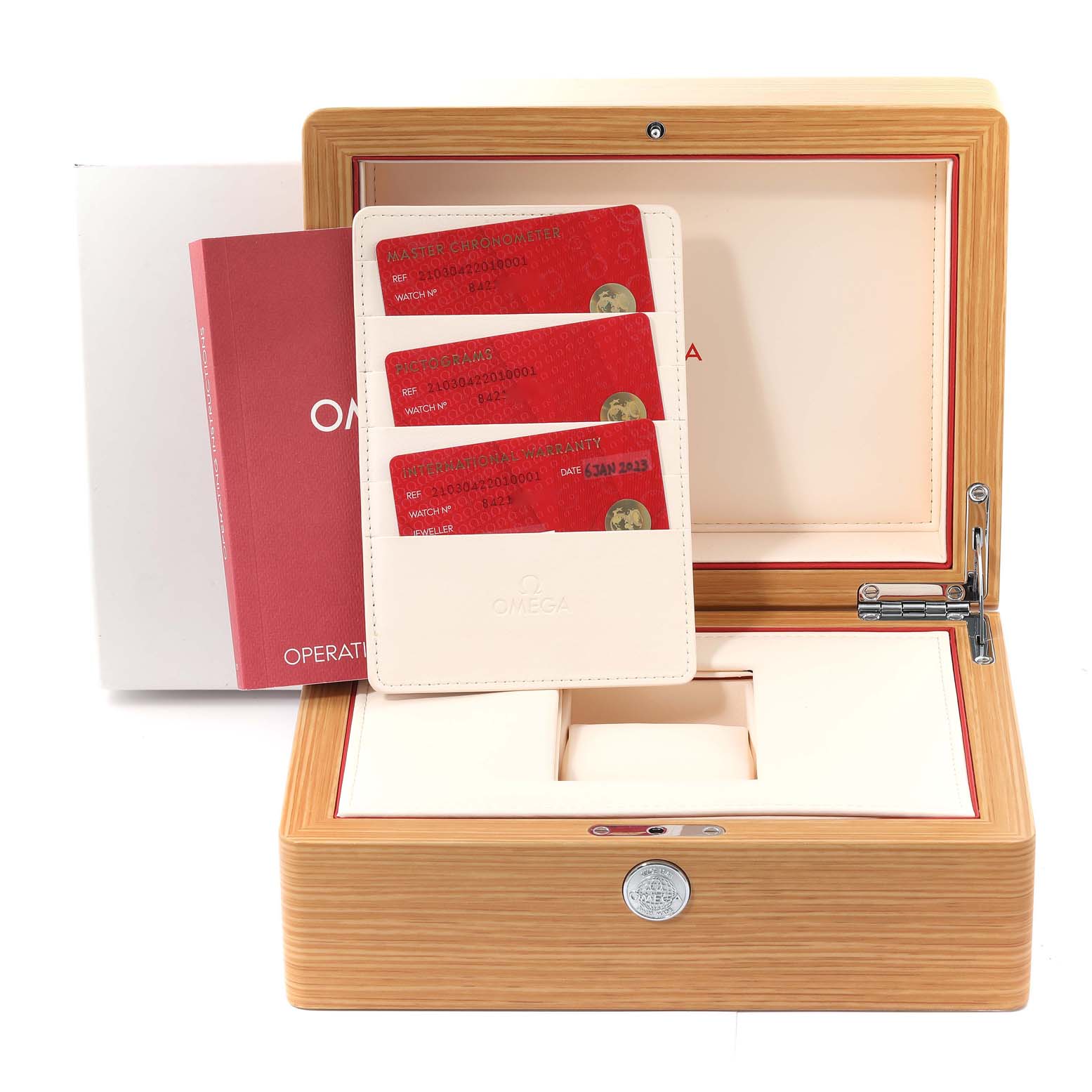 The image shows an Omega Seamaster 210.30.42.20.10.001 Men
s Stainless Steel Green Dial 210.30.42.20.10.001 Men
s Stainless Steel Green Dial watch box at an angle, with warranty cards and an operating manual.