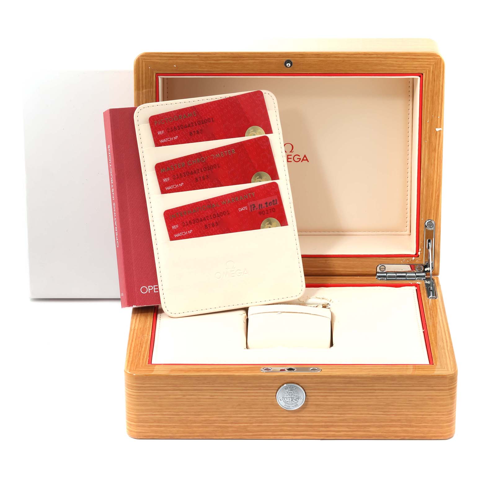 The image shows the packaging and accessories for the Omega Planet Ocean 215.30.44.21.01.001 Men
s Stainless Steel Black Dial 215.30.44.21.01.001 Men
s Stainless Steel Black Dial watch, including warranty cards, a user manual, and a box.