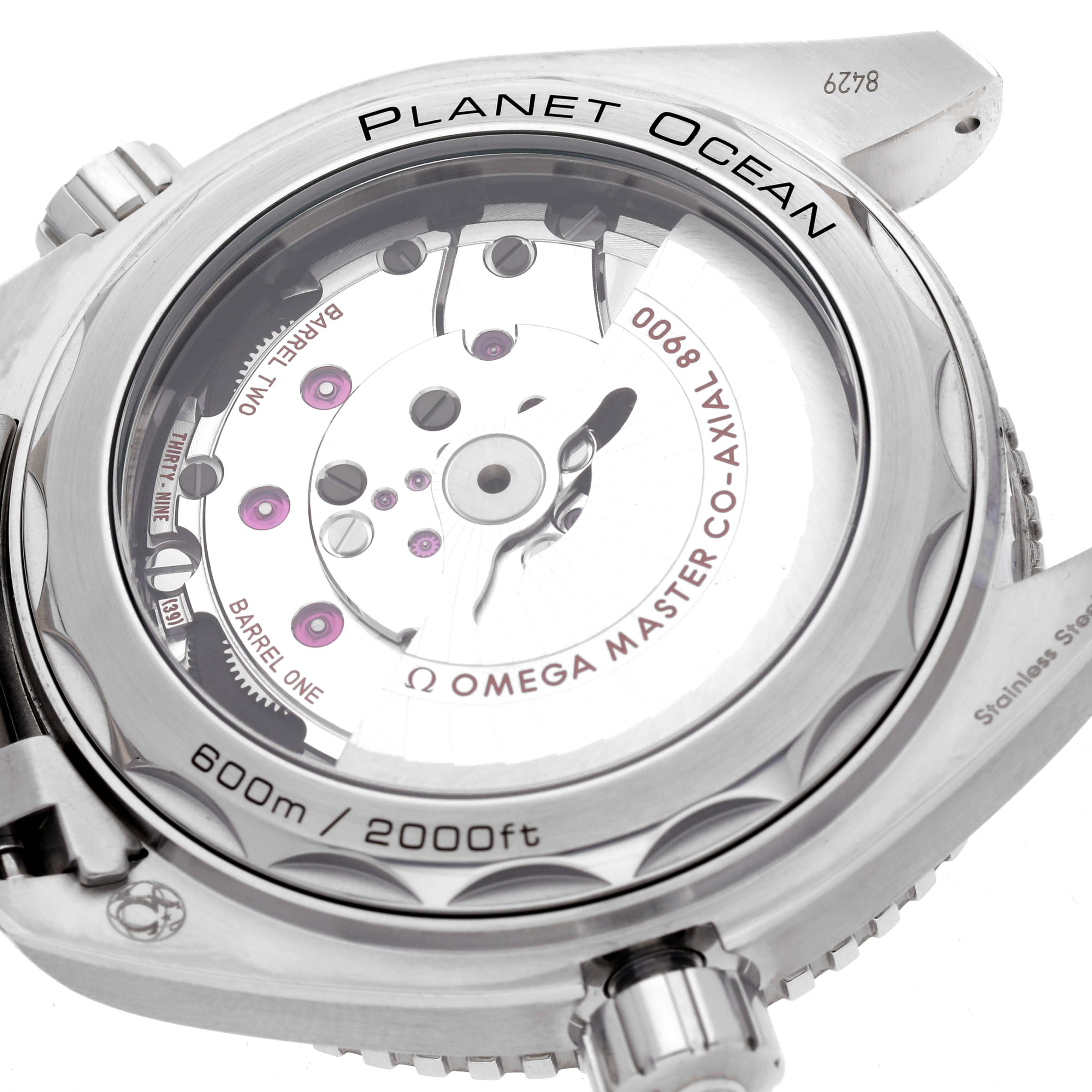 The Omega Planet Ocean 215.30.44.21.01.001 Men
s Stainless Steel Black Dial 215.30.44.21.01.001 Men
s Stainless Steel Black Dial watch is shown from the back, highlighting the movement and clear case back.