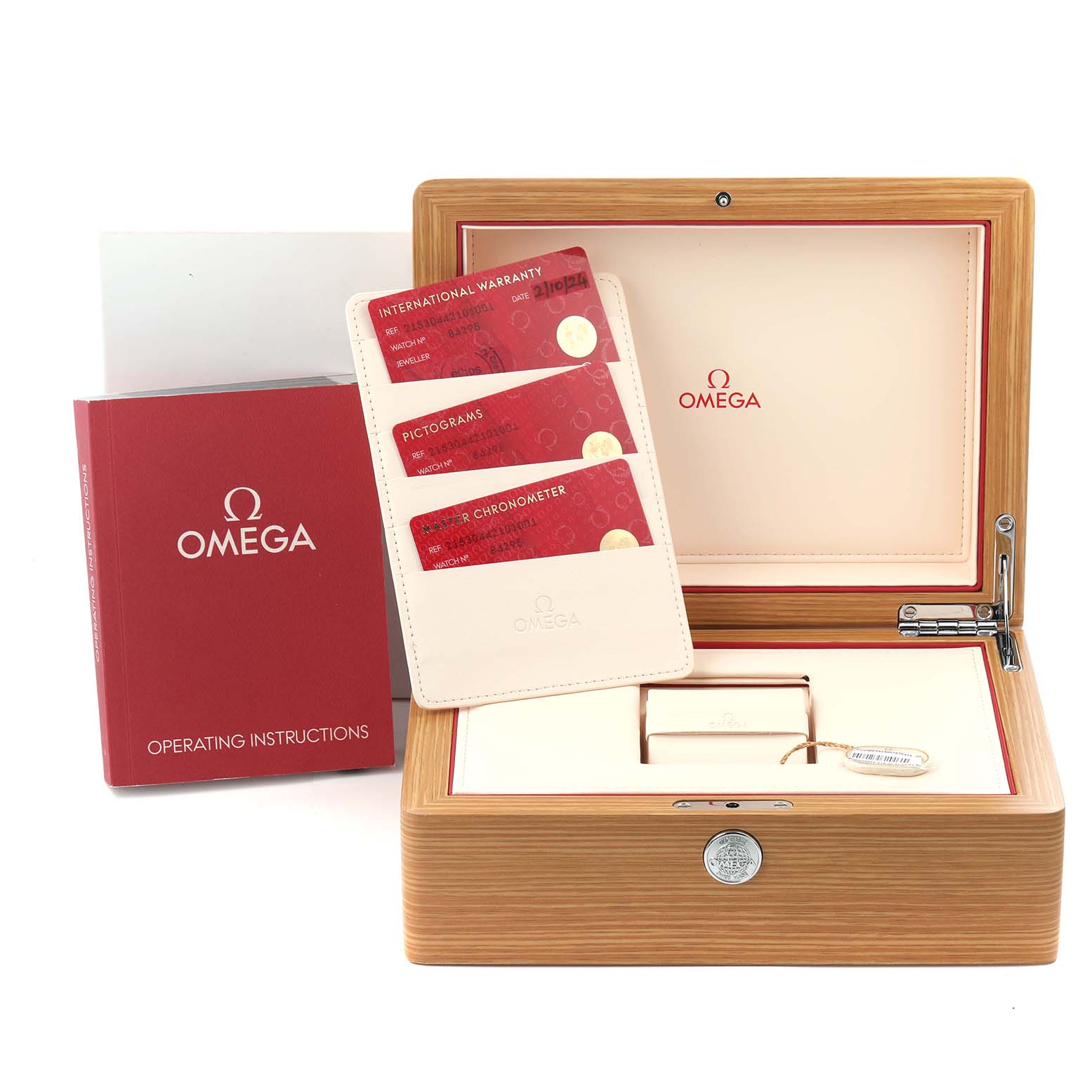 The image shows the accessories for an Omega Planet Ocean 215.30.44.21.01.001 Men
s Stainless Steel Black Dial 215.30.44.21.01.001 Men
s Stainless Steel Black Dial watch, including the open box, warranty cards, and manual.