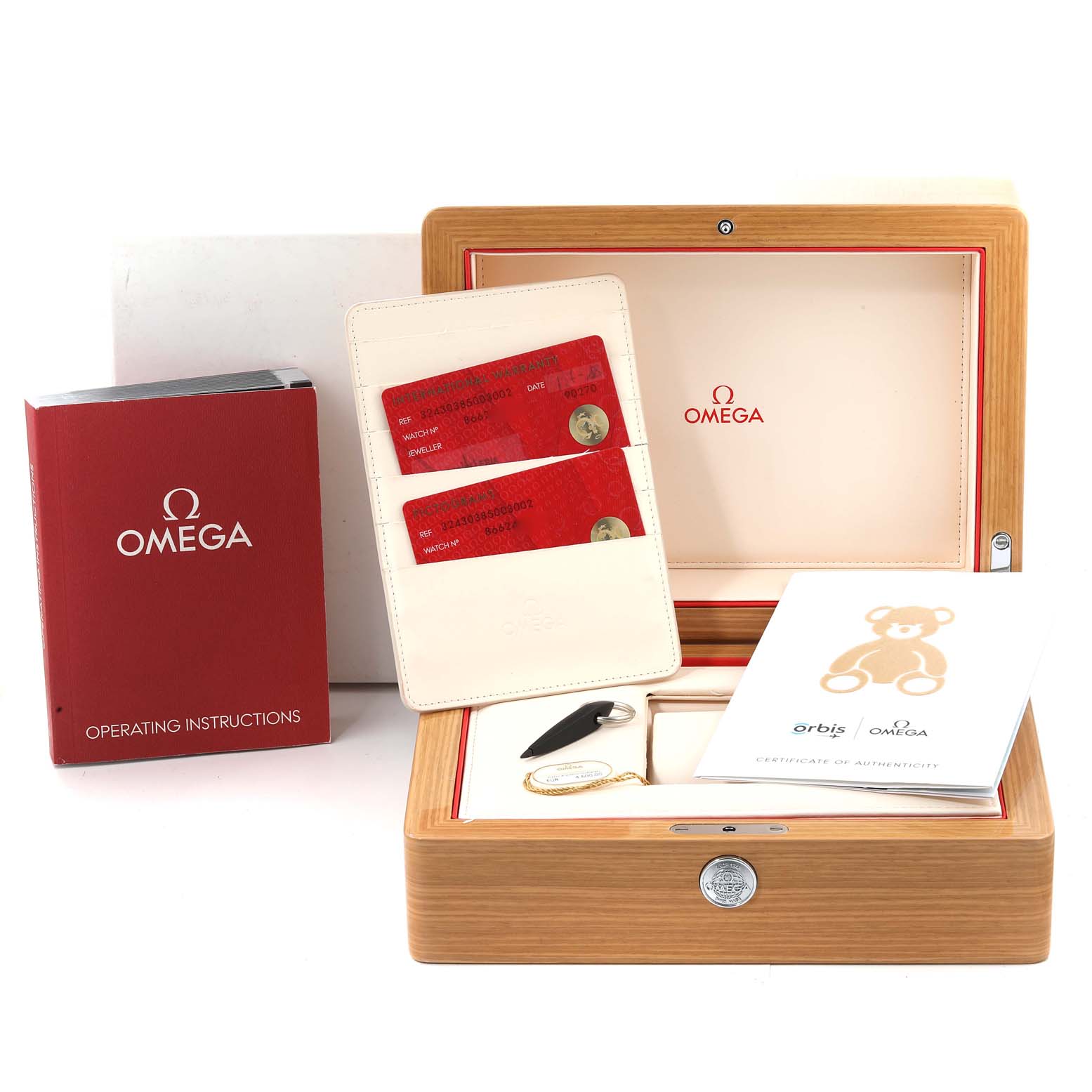 The image shows the packaging and accessories for an Omega Speedmaster 324.30.38.50.03.002 Men
s Stainless Steel Blue Dial 324.30.38.50.03.002 Men
s Stainless Steel Blue Dial, including a wooden box, instruction manual, cards, and certificates.