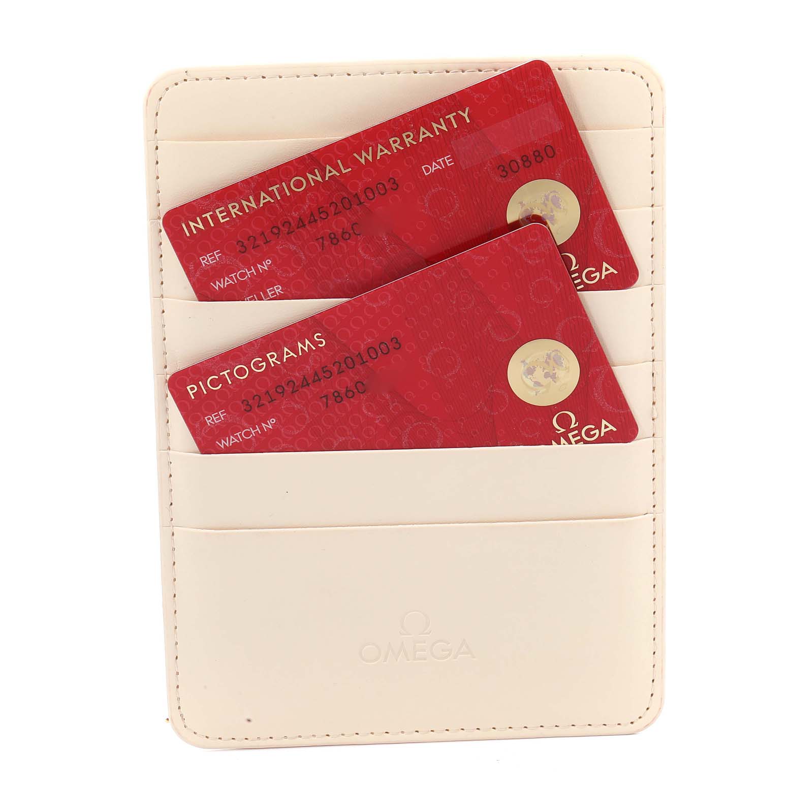 The image shows an Omega Speedmaster 321.92.44.52.01.003 Men
s Titanium Black Dial 321.92.44.52.01.003 Men
s Titanium Black Dial model
s international warranty and pictograms cards in a cream-colored cardholder.