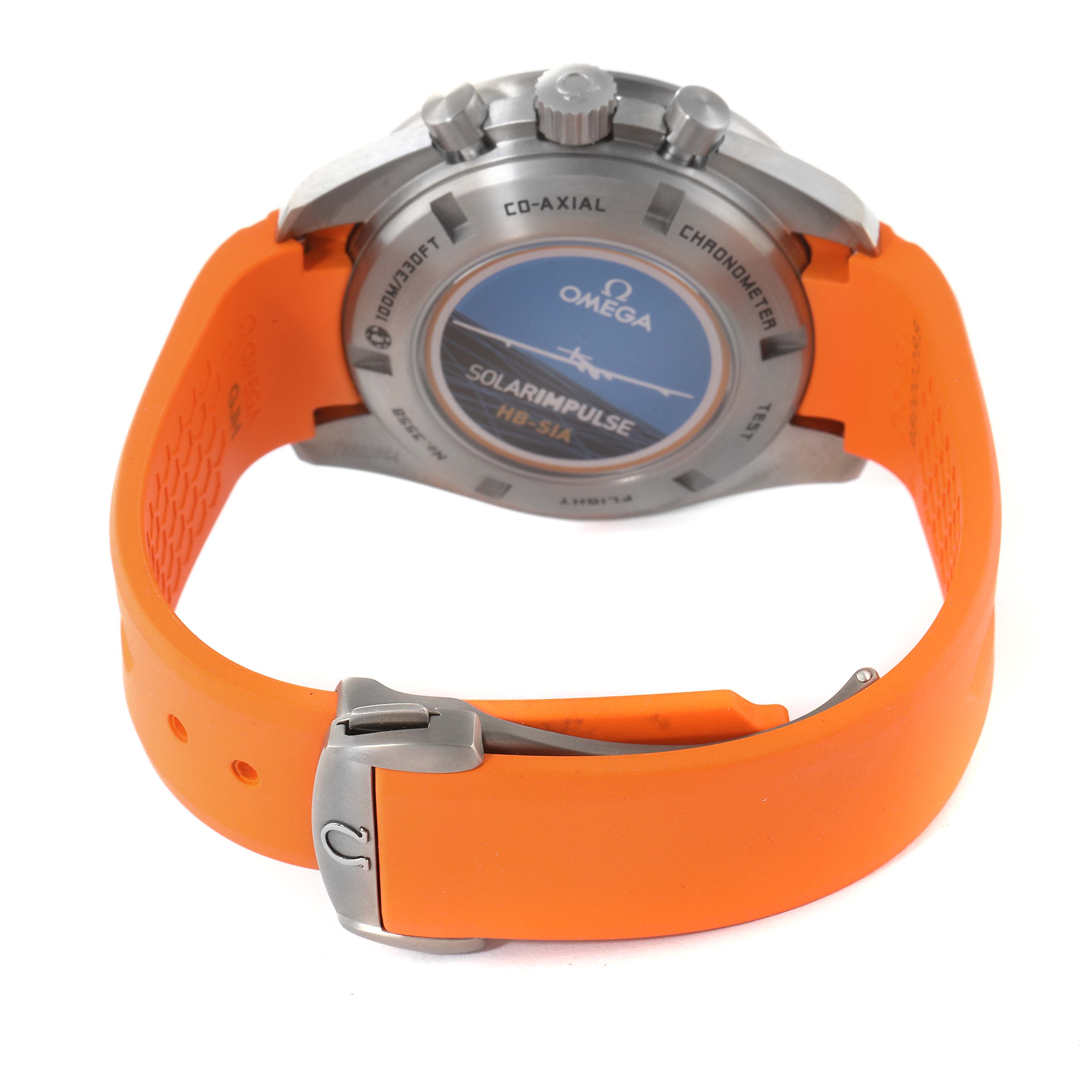 The image shows the back case and the orange strap with a clasp of an Omega Speedmaster 321.92.44.52.01.003 Men
s Titanium Black Dial 321.92.44.52.01.003 Men
s Titanium Black Dial watch viewed from the rear angle.