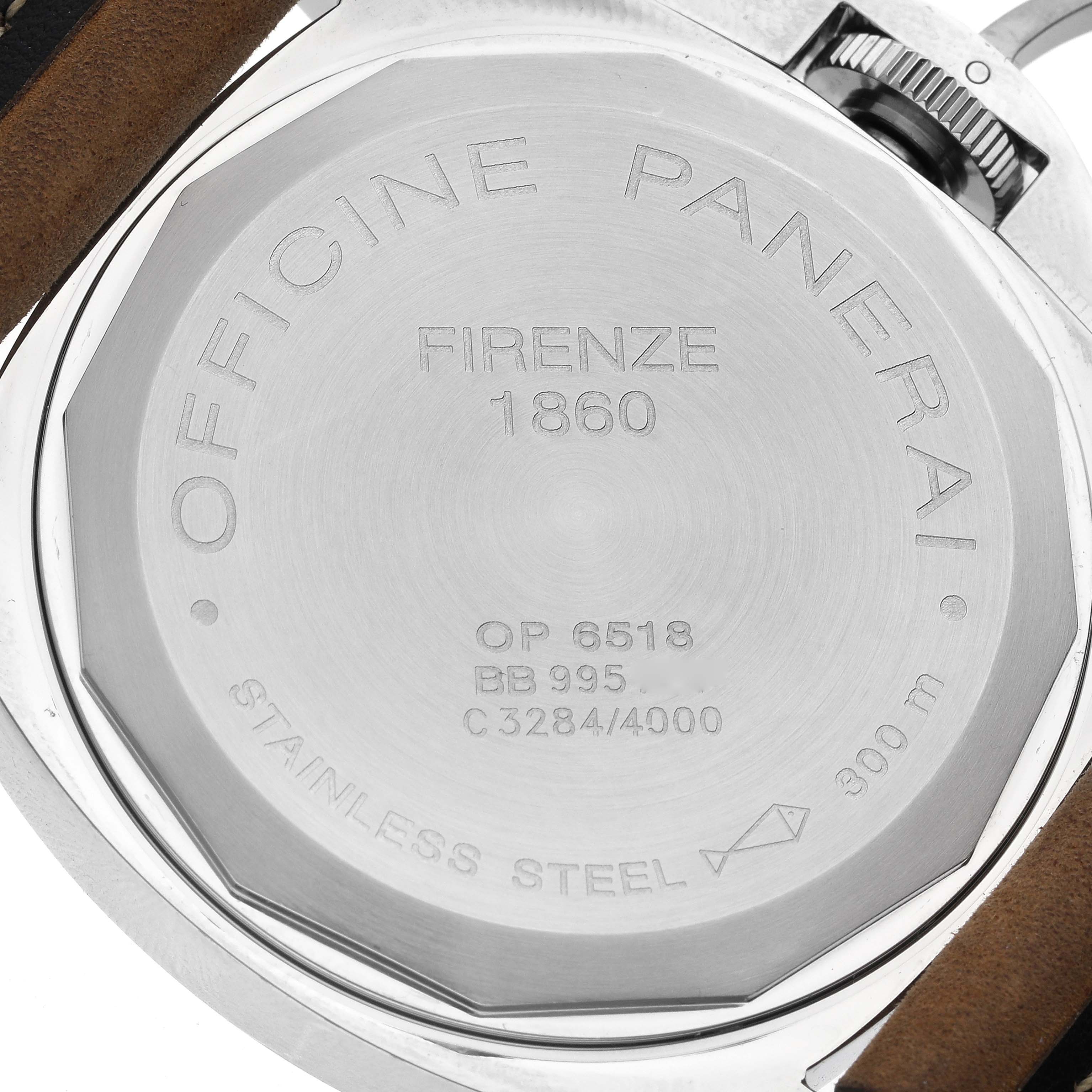 The image shows the back case of a Panerai Luminor PAM00001 Men's Stainless Steel Black Dial PAM00001 Men's Stainless Steel Black Dial watch, displaying engravings and a leather strap.