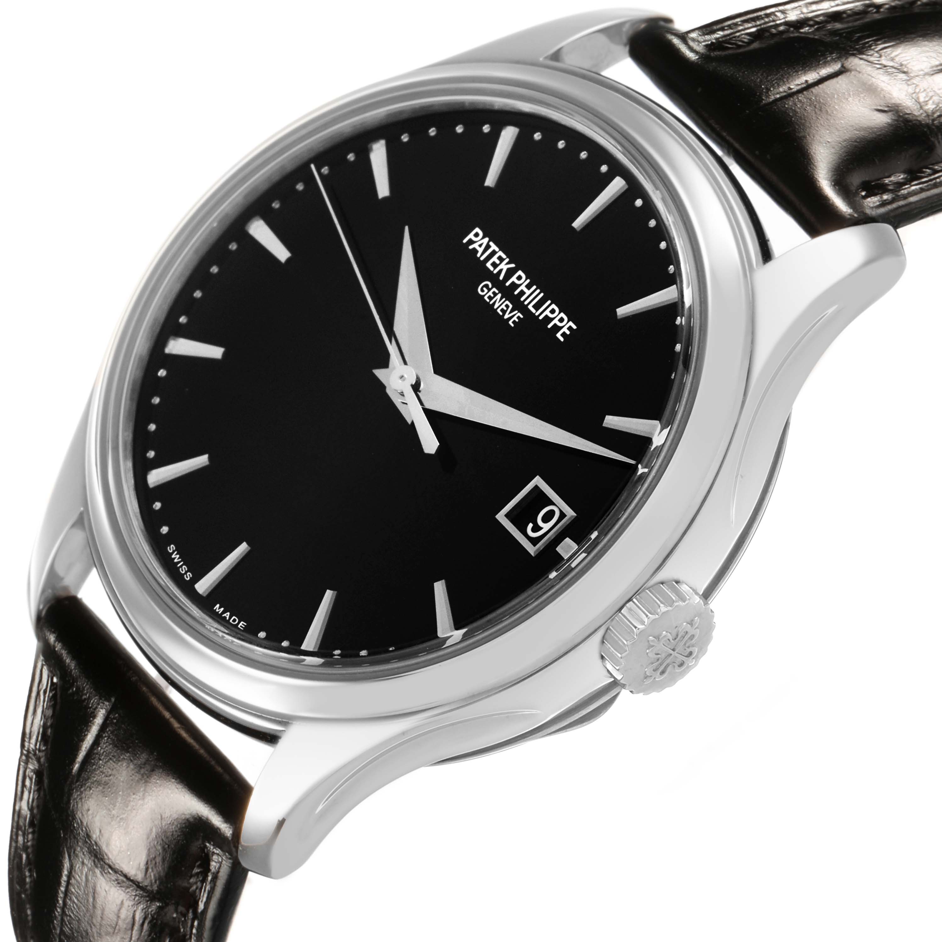 The Patek Philippe Calatrava 5227G-010 Men's White Gold Black Dial watch is shown at a slight side angle, featuring its black dial, silver hands, date window, and leather strap.