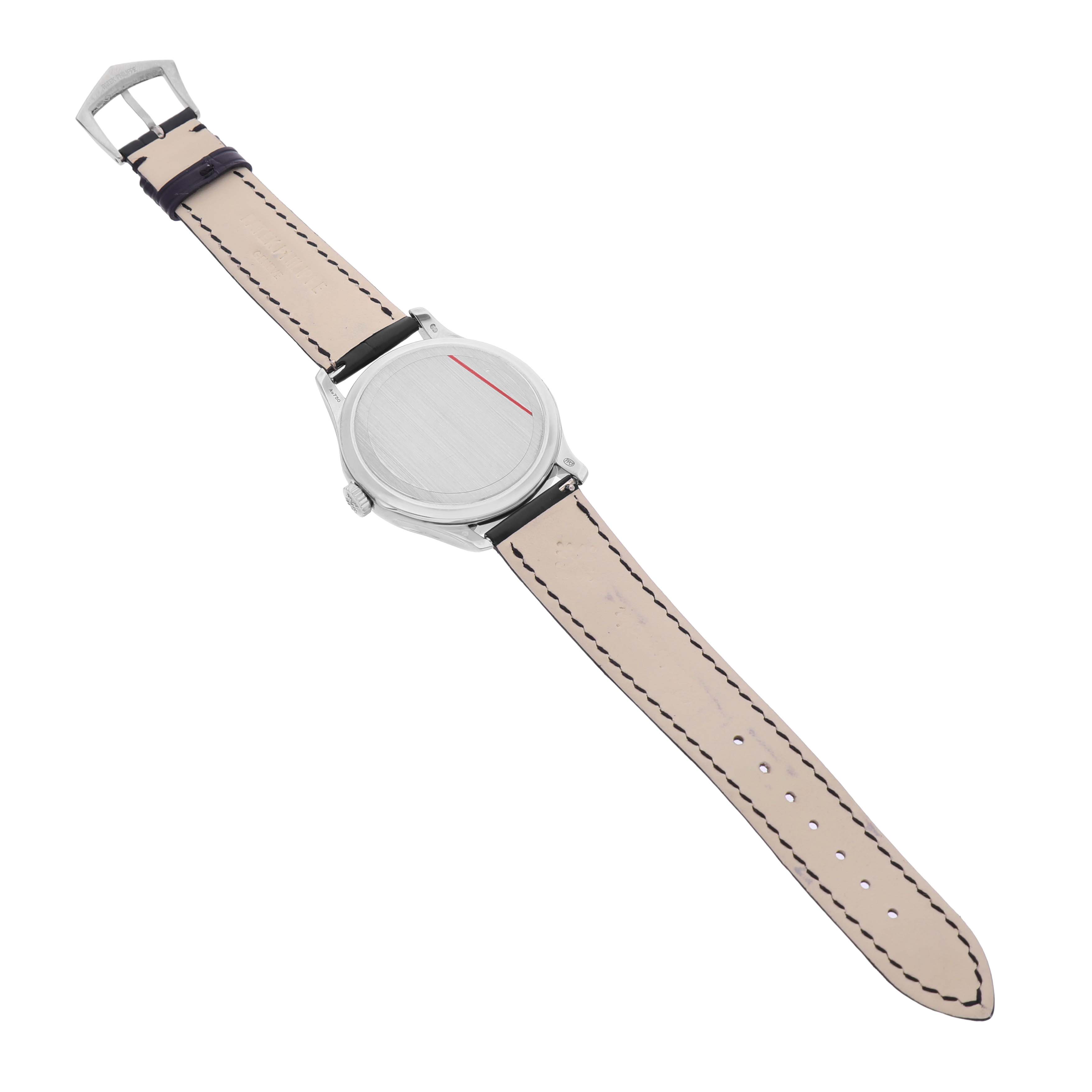 The image shows a Patek Philippe Calatrava 5227G-010 Men's White Gold Black Dial watch from the back, highlighting the case back, strap, and buckle.
