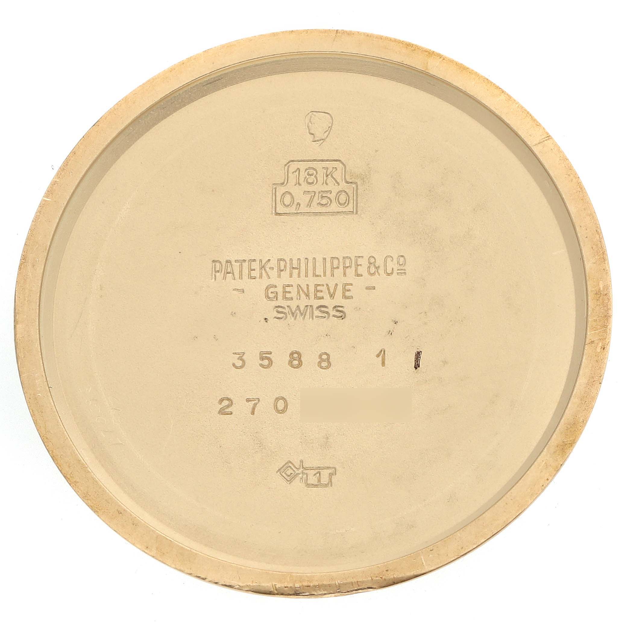 The image shows the inner side of a Patek Philippe Calatrava 3588J Men's Yellow Gold Beige Dial watch case back with engravings and hallmarks.