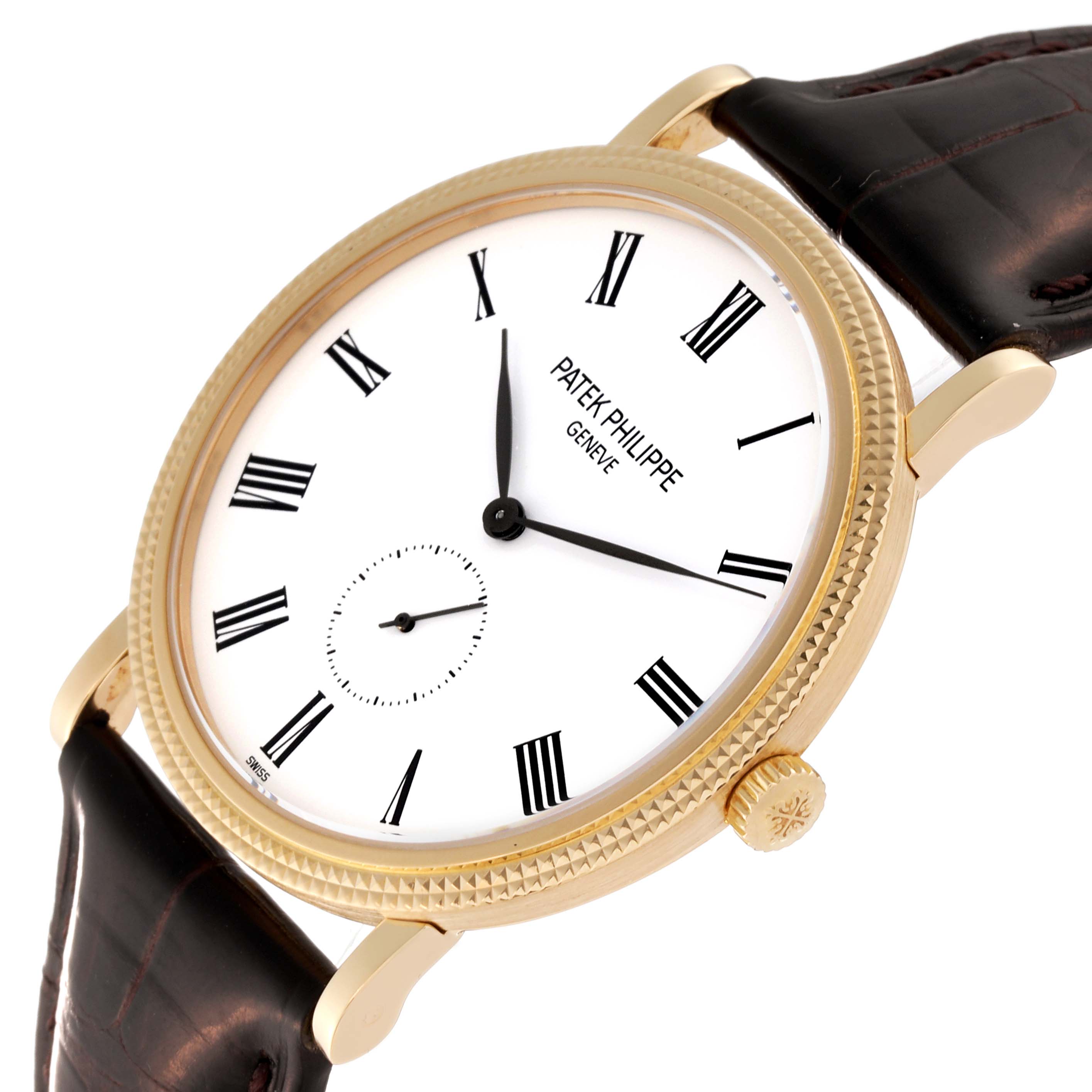 This image shows a Calatrava model by Patek Philippe at an angled view, highlighting the watch face, crown, and leather strap.