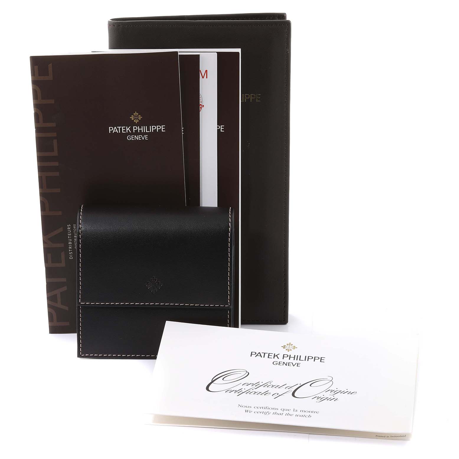 The image displays accessories including manuals, a certificate, and a black leather pouch for the Patek Philippe Calatrava 5119J Men's Yellow Gold White Dial 5119J Men's Yellow Gold White Dial model.