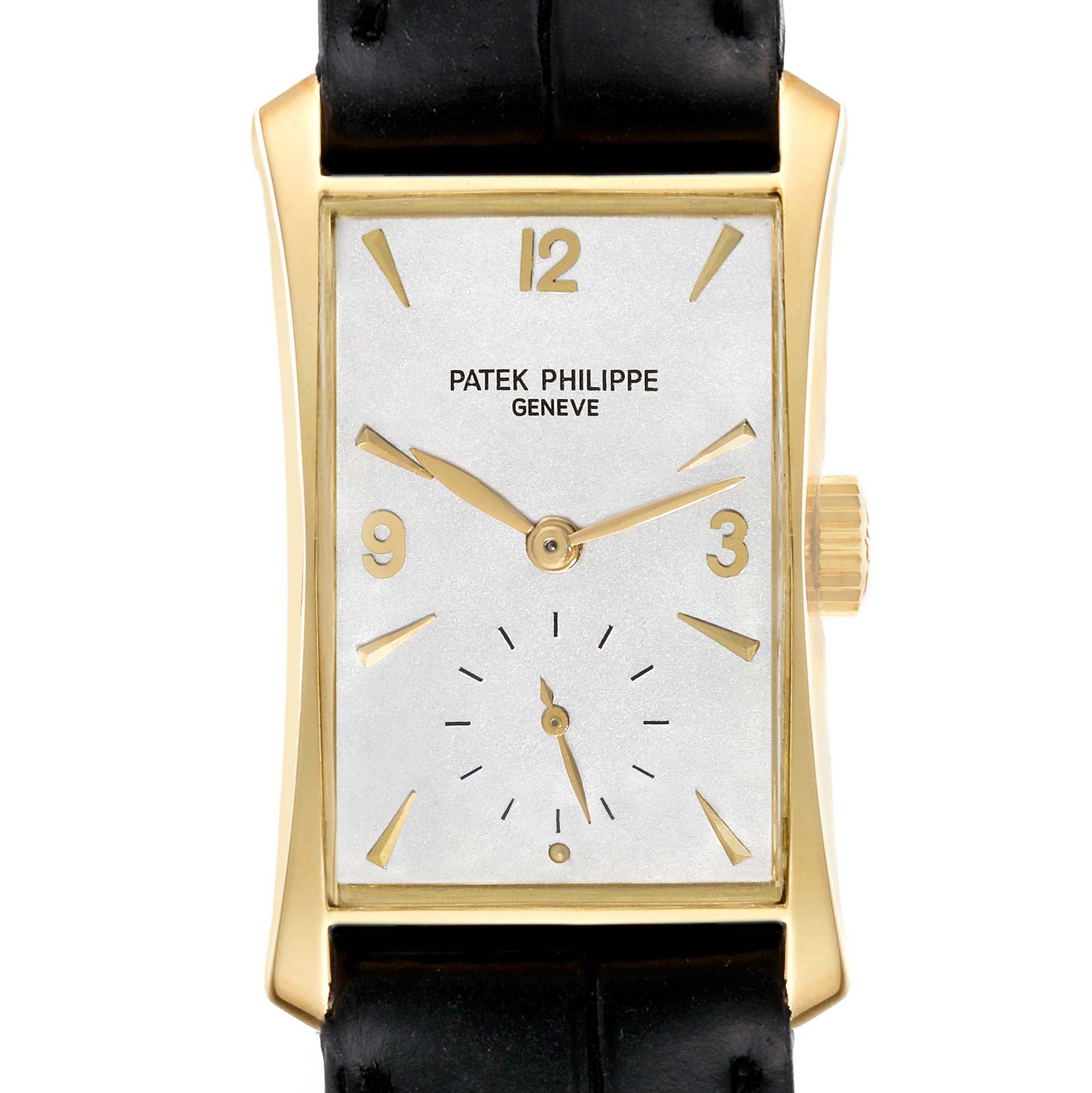 The Patek Philippe Vintage 2468 Men's Yellow Gold Silver Dial model is shown from a front angle, highlighting its rectangular gold case, dial, and black leather strap.