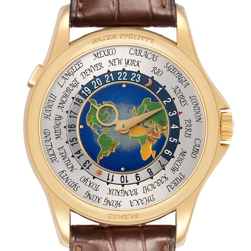 The image shows a top view of the Patek Philippe Complications 5131J-001 Men's Yellow Gold Silver Dial watch, highlighting its world time dial and gold case.