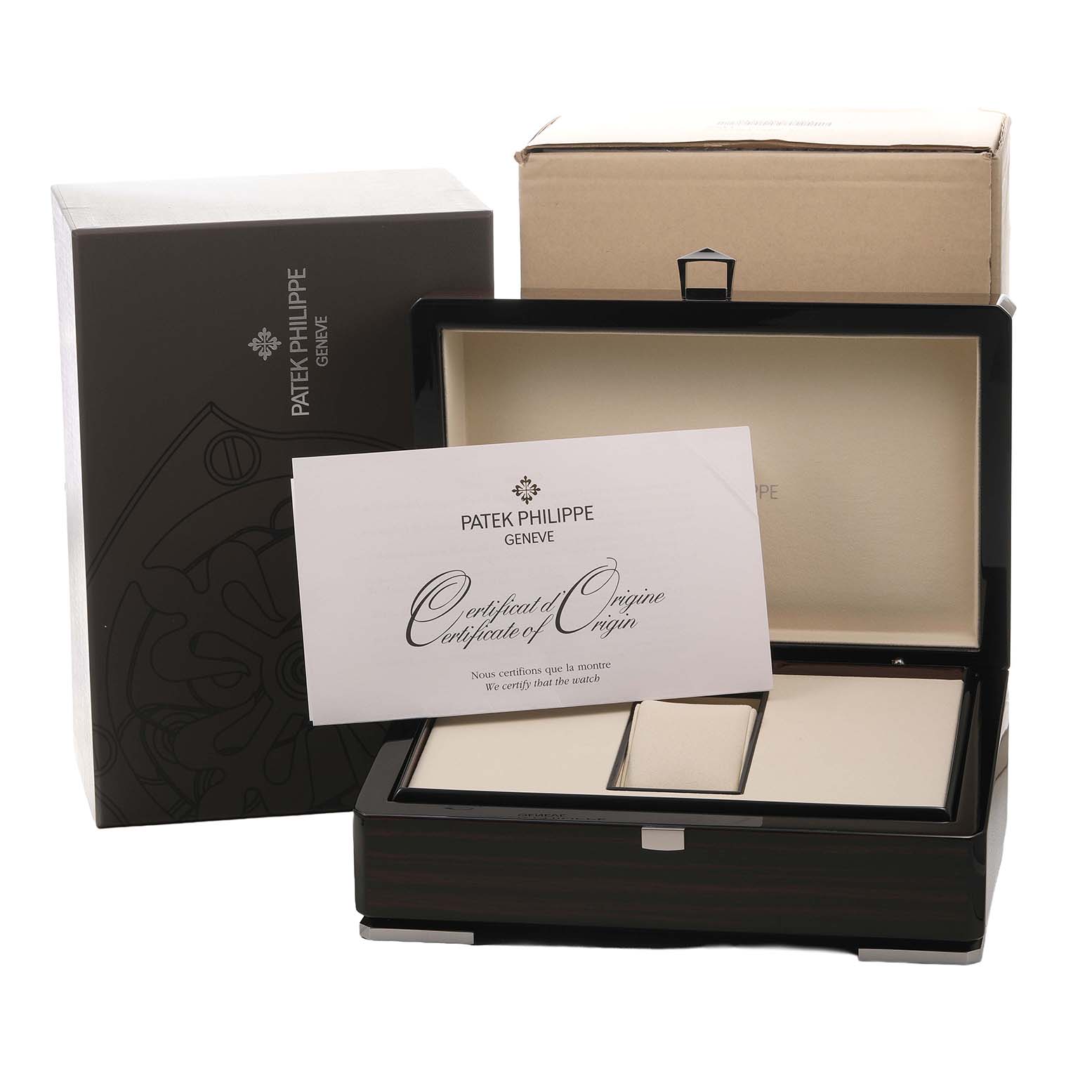 The image shows the packaging and certificate for a Patek Philippe Complications 5131J-001 Men's Yellow Gold Silver Dial watch, with an open box and document displayed.
