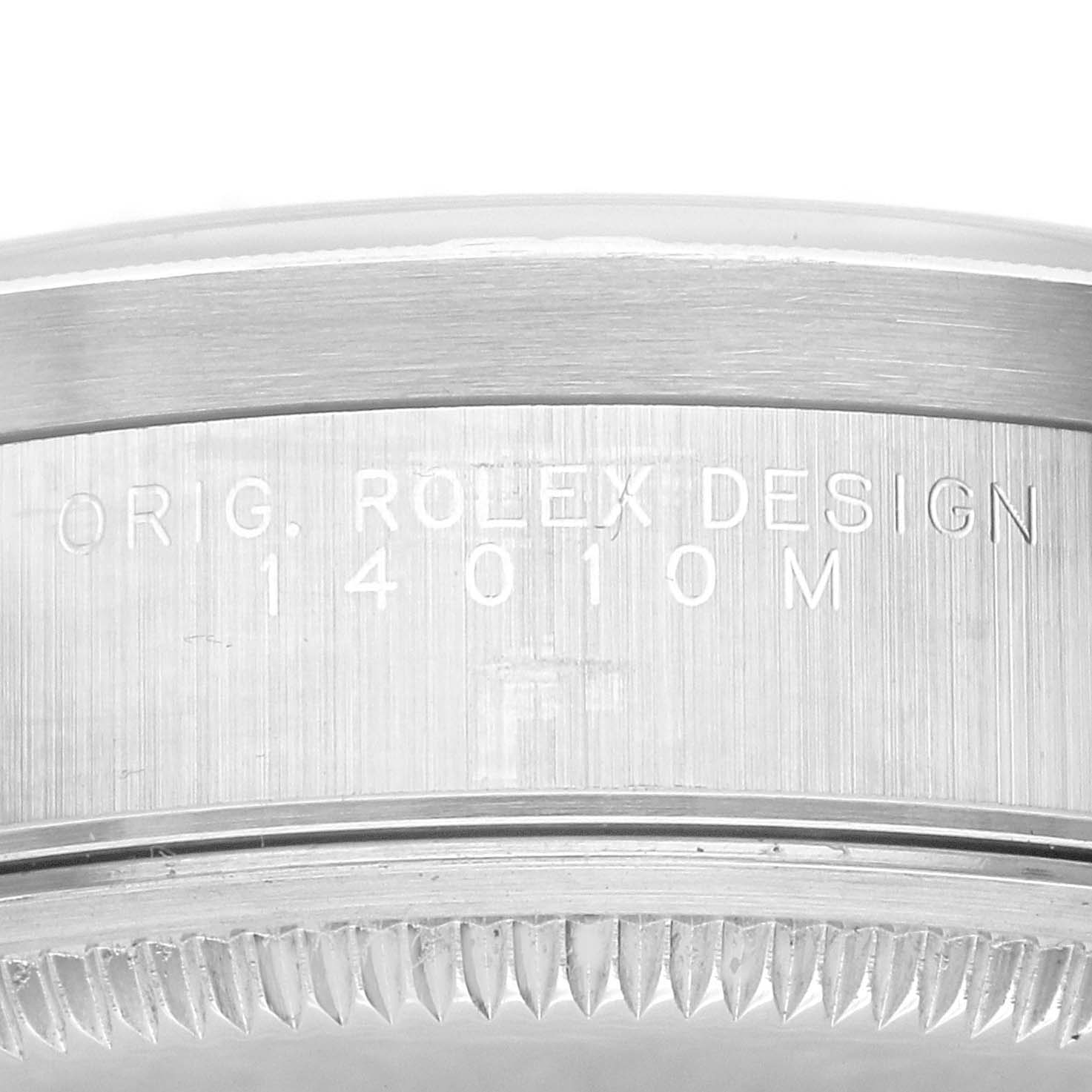 The image shows a close-up of the model and serial number engraving on the case side of a Rolex Air-King 14010 Men's Stainless Steel Blue Dial 14010 Men's Stainless Steel Blue Dial watch.