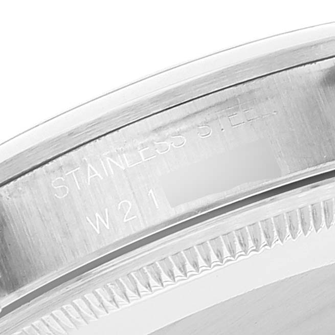 The image shows a close-up of the engravings on the stainless steel bezel and edge of a Rolex Date 15200 Men's Stainless Steel Black Dial 15200 Men's Stainless Steel Black Dial watch.