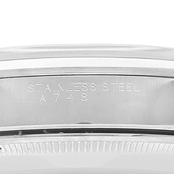The image shows a close-up of the inner bezel with "STAINLESS STEEL" engravings on a Rolex Date 15200 Men's Stainless Steel Silver Dial 15200 Men's Stainless Steel Silver Dial model watch.