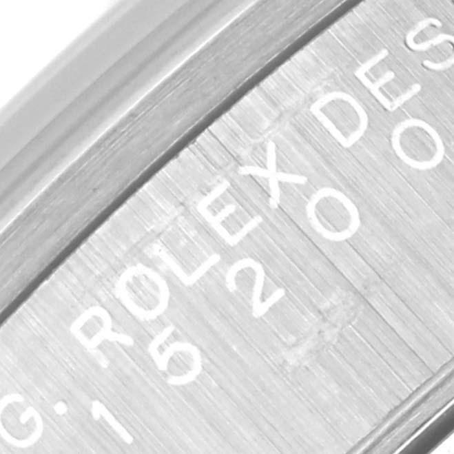 The image shows a close-up of the side engraving on the case of a Rolex Date 15200 Men
s Stainless Steel Silver Dial 15200 Men
s Stainless Steel Silver Dial model watch.