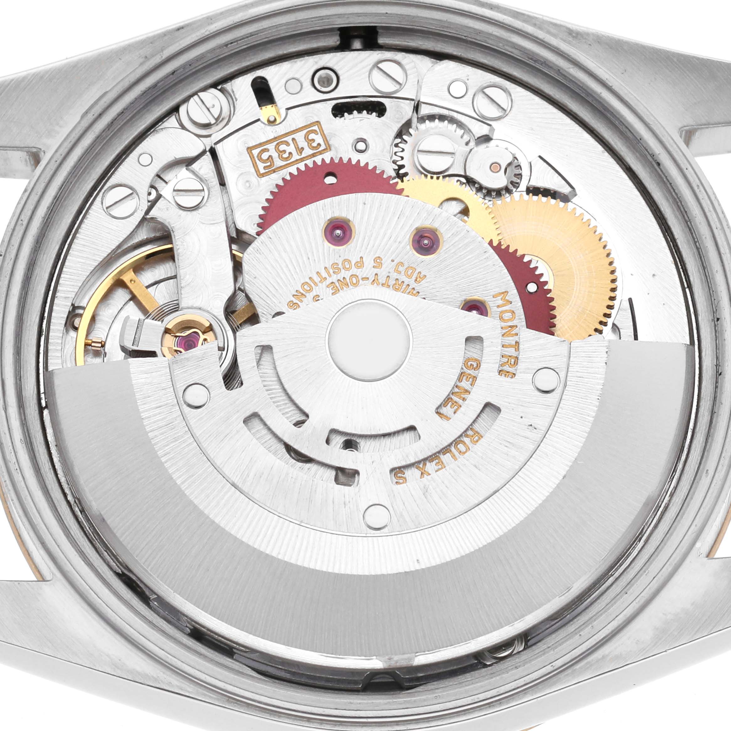 The image shows the Rolex Date 15223 Men
s Steel and Gold (two tone) Champagne Dial 15223 Men
s Steel and Gold (two tone) Champagne Dial model
s automatic movement parts, viewed from the back with the case open.