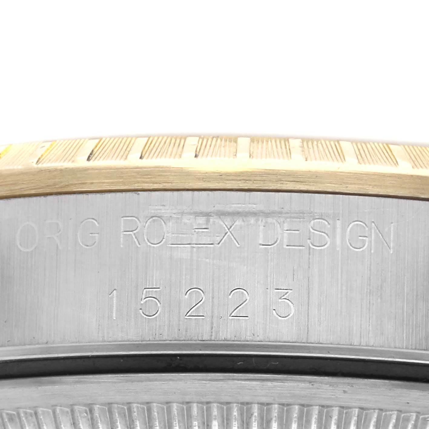 The image shows a close-up of the Date model by Rolex focusing on the engraved case side and bezel.