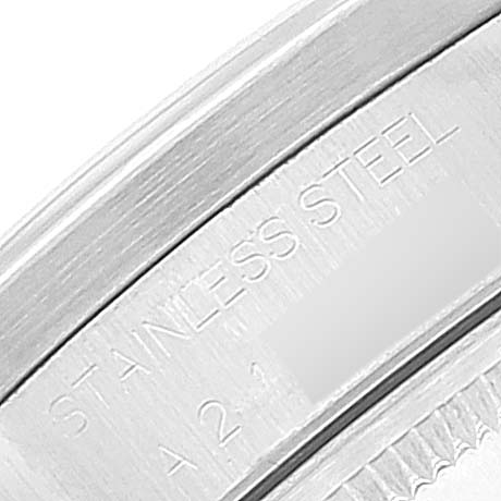 This image shows a close-up of the stainless steel engraving on the case back of a Rolex Date 15210 Men's Stainless Steel White Dial 15210 Men's Stainless Steel White Dial model watch.