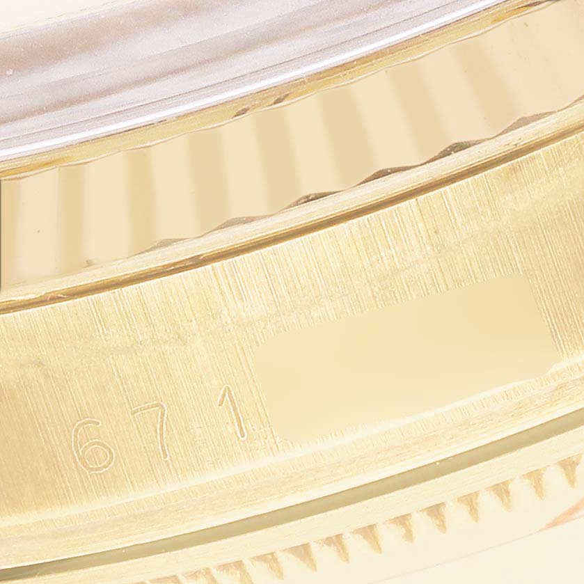 The image shows a close-up of the case edge and fluted bezel of a Rolex Date 15037 Men's Yellow Gold Champagne Dial model.