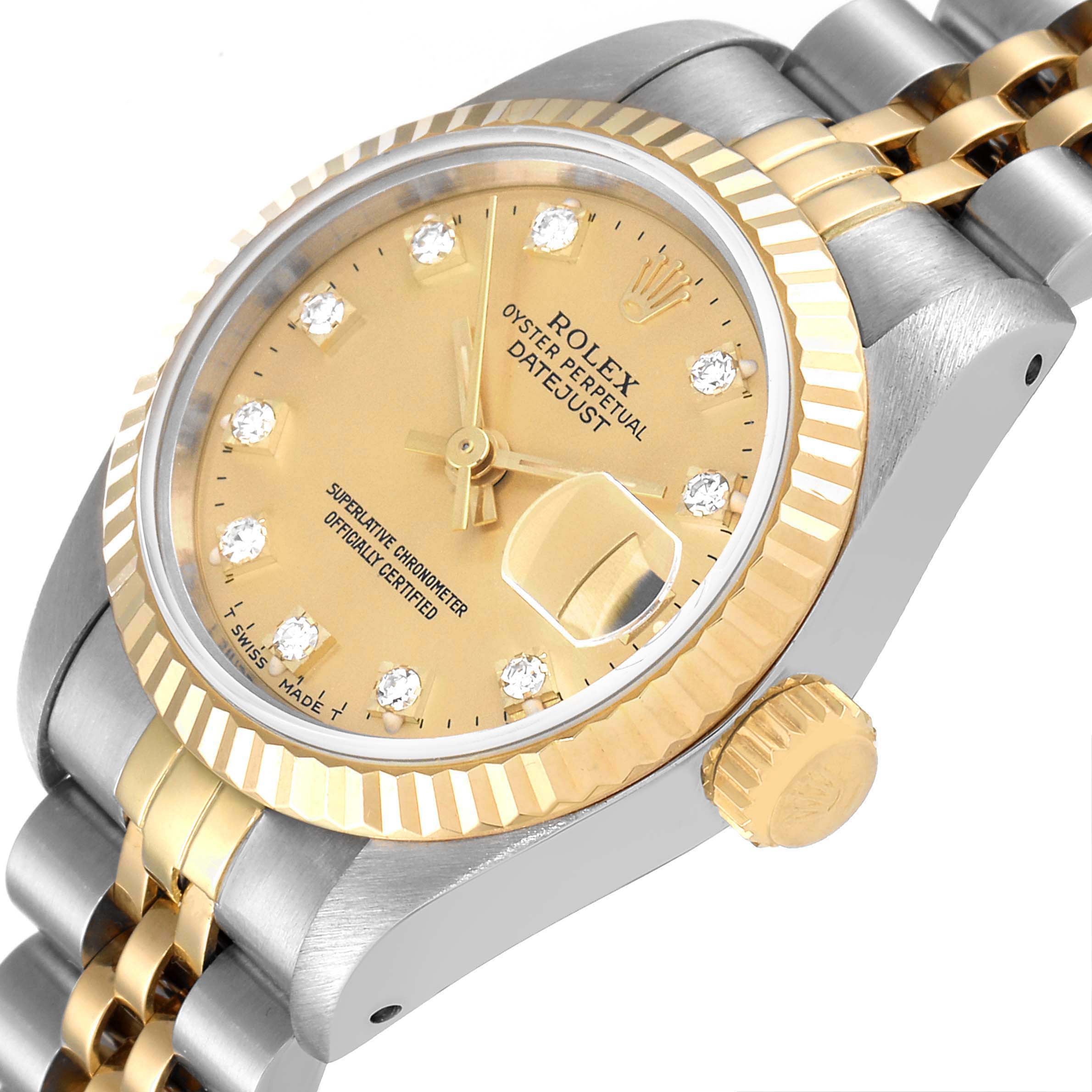The image shows a close-up, angled view of the Rolex Datejust 69173 Women
s Steel and Gold (two tone) Champagne Dial 69173 Women
s Steel and Gold (two tone) Champagne Dial watch, highlighting its dial, bezel, crown, and part of the bracelet.