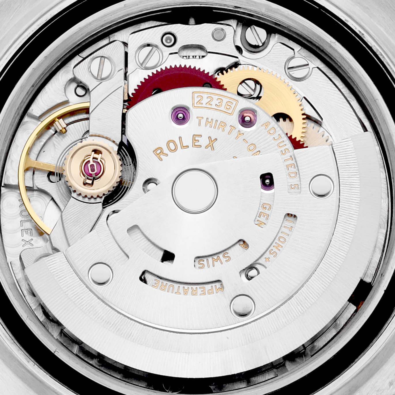 This is a close-up view of the Rolex Datejust 279171 Women's Steel and Gold (two tone) White Dial 279171 Women's Steel and Gold (two tone) White Dial model's movement, showing wheels, jewels, and the engraved rotor.