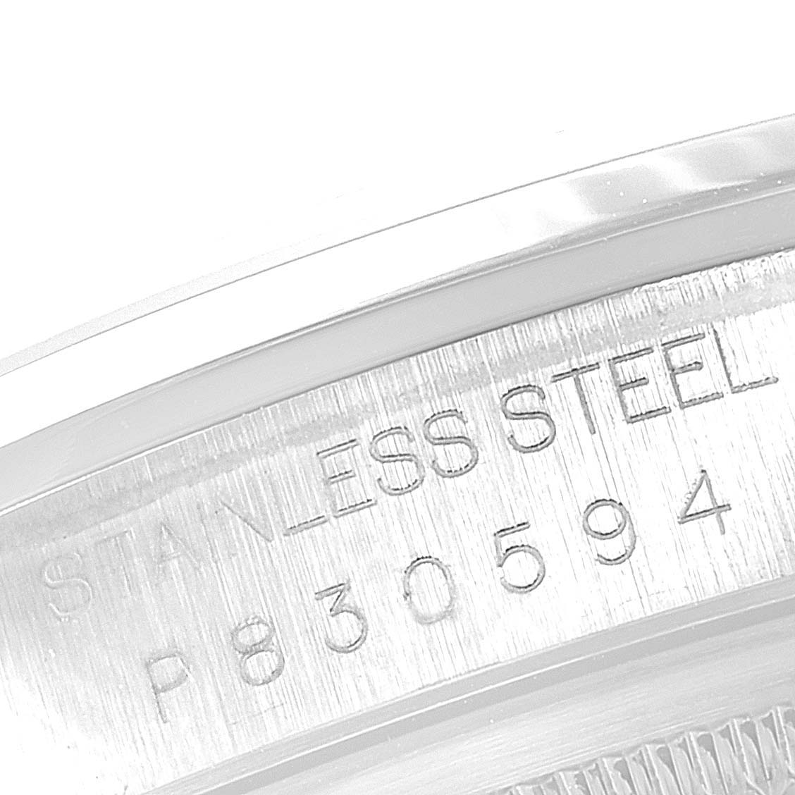 This image shows a close-up of the serial number and "STAINLESS STEEL" engraving on the case of a Rolex Datejust 16200 Men
s Stainless Steel Grey Dial 16200 Men
s Stainless Steel Grey Dial watch.