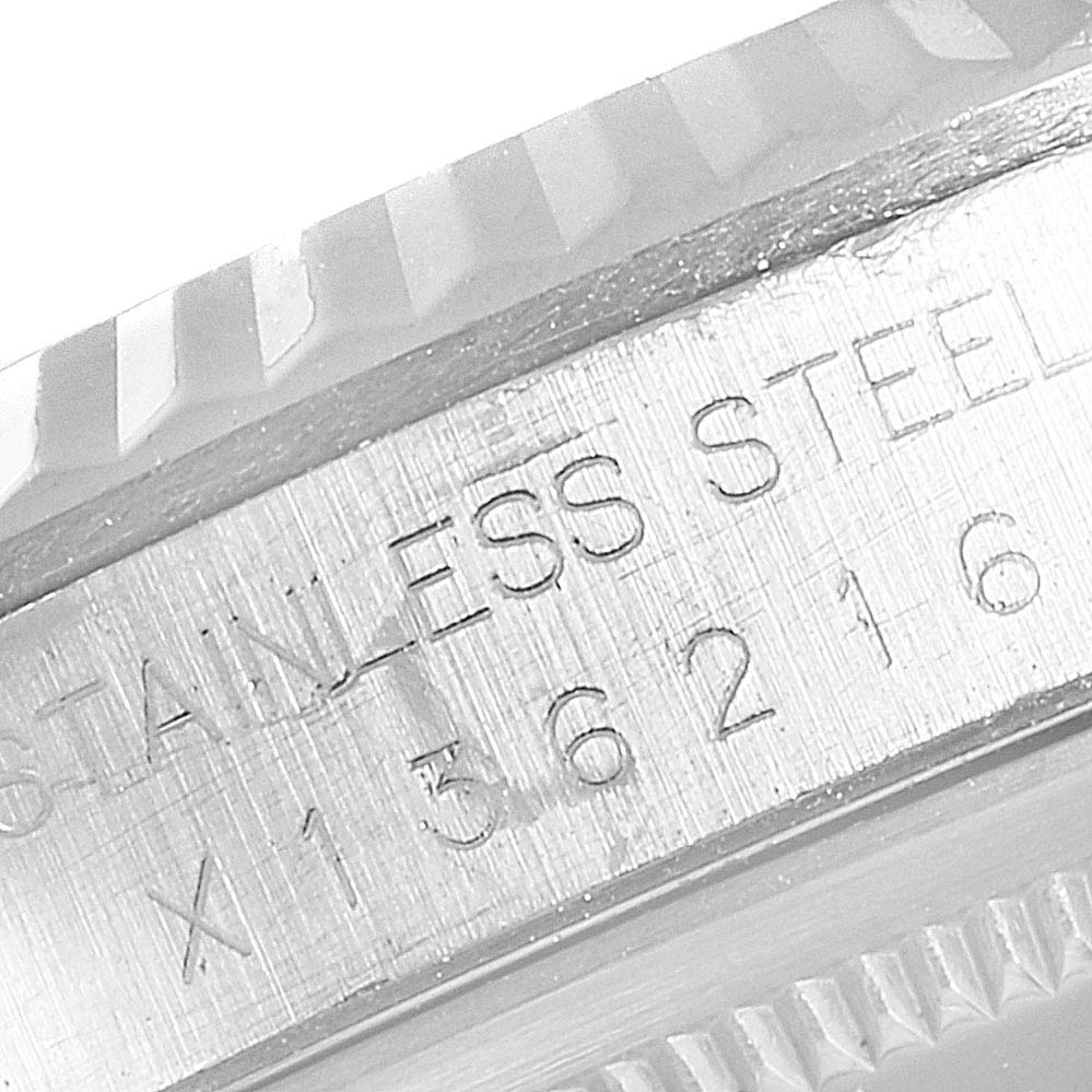 This image shows a close-up of the engraved side of the bezel and case for a Rolex Datejust 16234 Men's Stainless Steel Black Dial 16234 Men's Stainless Steel Black Dial watch in stainless steel.