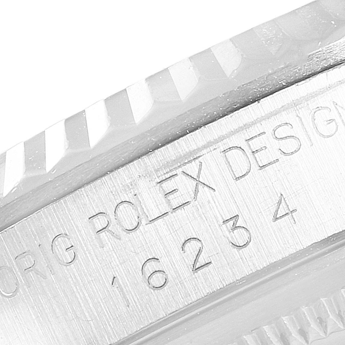 The image shows a close-up of the engraved serial number and bezel detail of a Rolex Datejust 16234 Men's Stainless Steel Black Dial 16234 Men's Stainless Steel Black Dial watch.