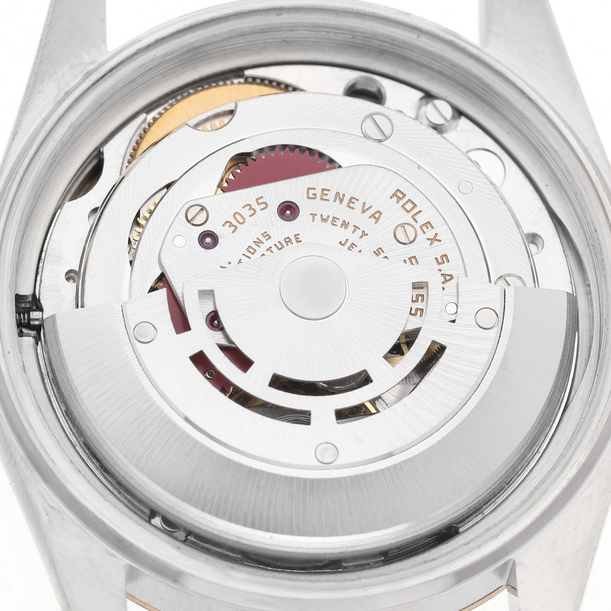 The image shows the back of the Rolex Datejust 16013 Men's Steel and Gold (two tone) Champagne Dial watch, highlighting the intricate movement and inner mechanisms.