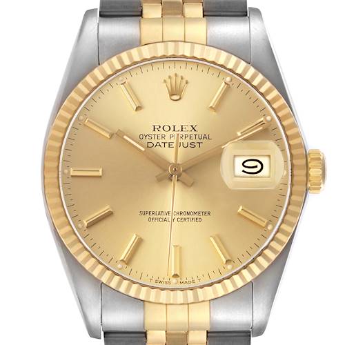 The Rolex Datejust 16013 Men's Steel and Gold (two tone) Champagne Dial watch is shown from a front view, highlighting the dial, fluted bezel, and part of the bracelet.
