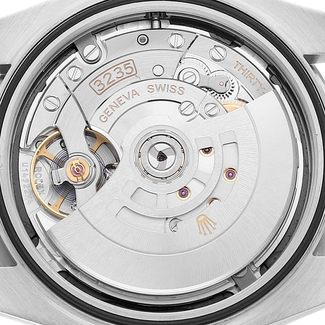 The image shows the movement of a Rolex Datejust 41 126334 Men
s Stainless Steel Black Dial 126334 Men
s Stainless Steel Black Dial model viewed from the back, highlighting the intricate internal mechanisms and parts.