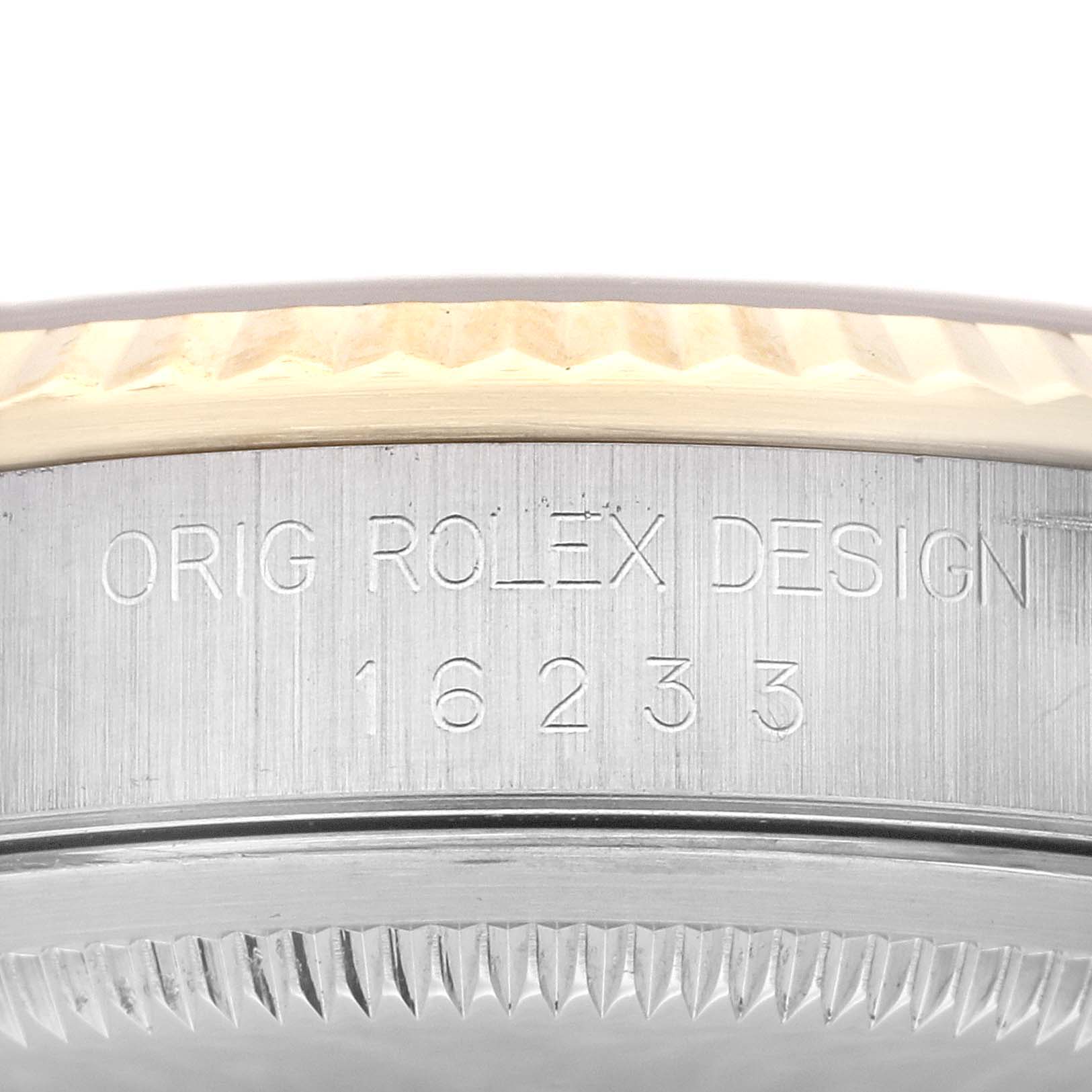 This image shows a close-up view of the side of the case of a Rolex Datejust 16233 Men's Steel and Gold (two tone) Champagne Dial 16233 Men's Steel and Gold (two tone) Champagne Dial, displaying "ORIG ROLEX DESIGN" and the model number "16233."
