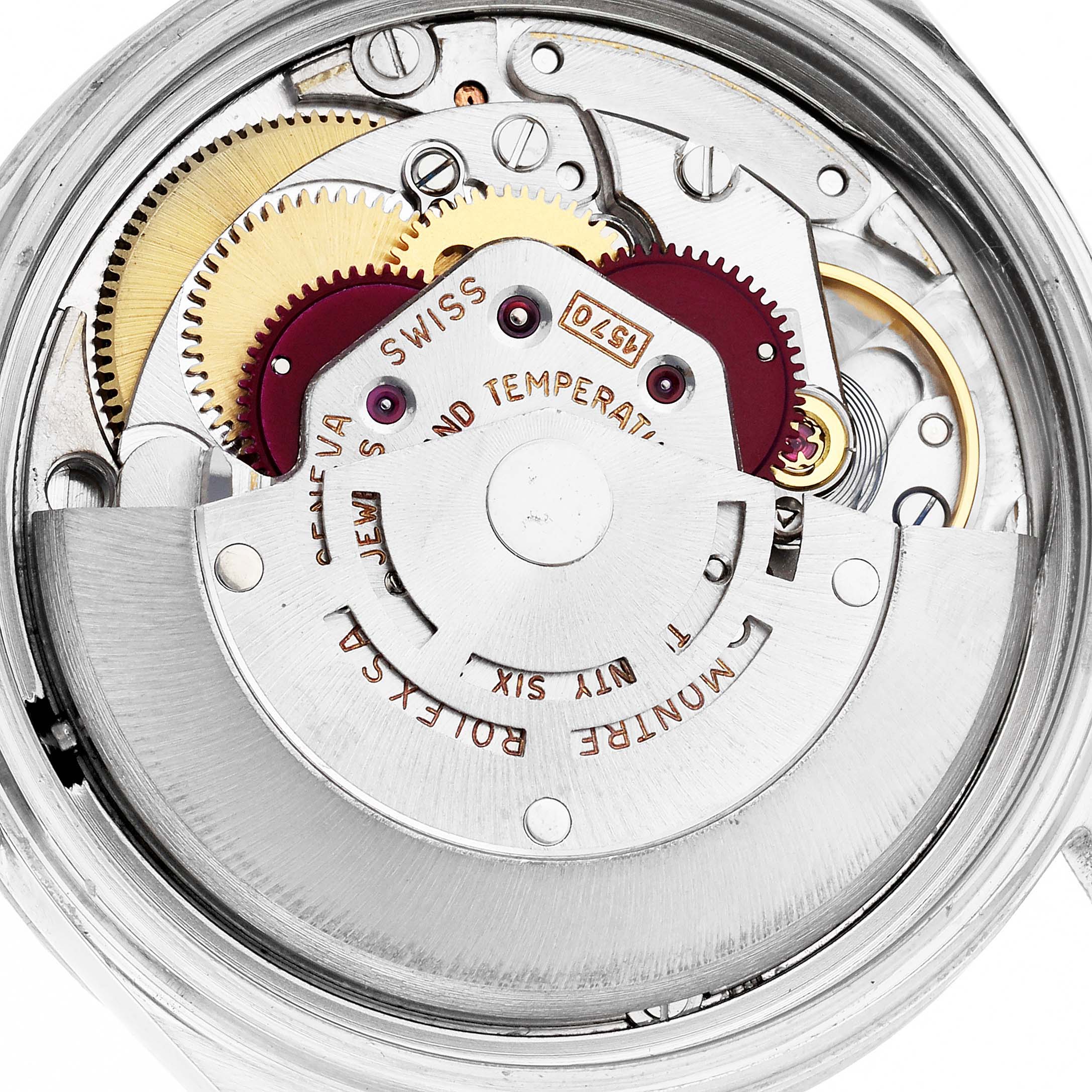 The image shows the movement mechanism of a Rolex Datejust 1603 Men
s Stainless Steel Silver Dial 1603 Men
s Stainless Steel Silver Dial, highlighting gears and the rotor from a top angle.
