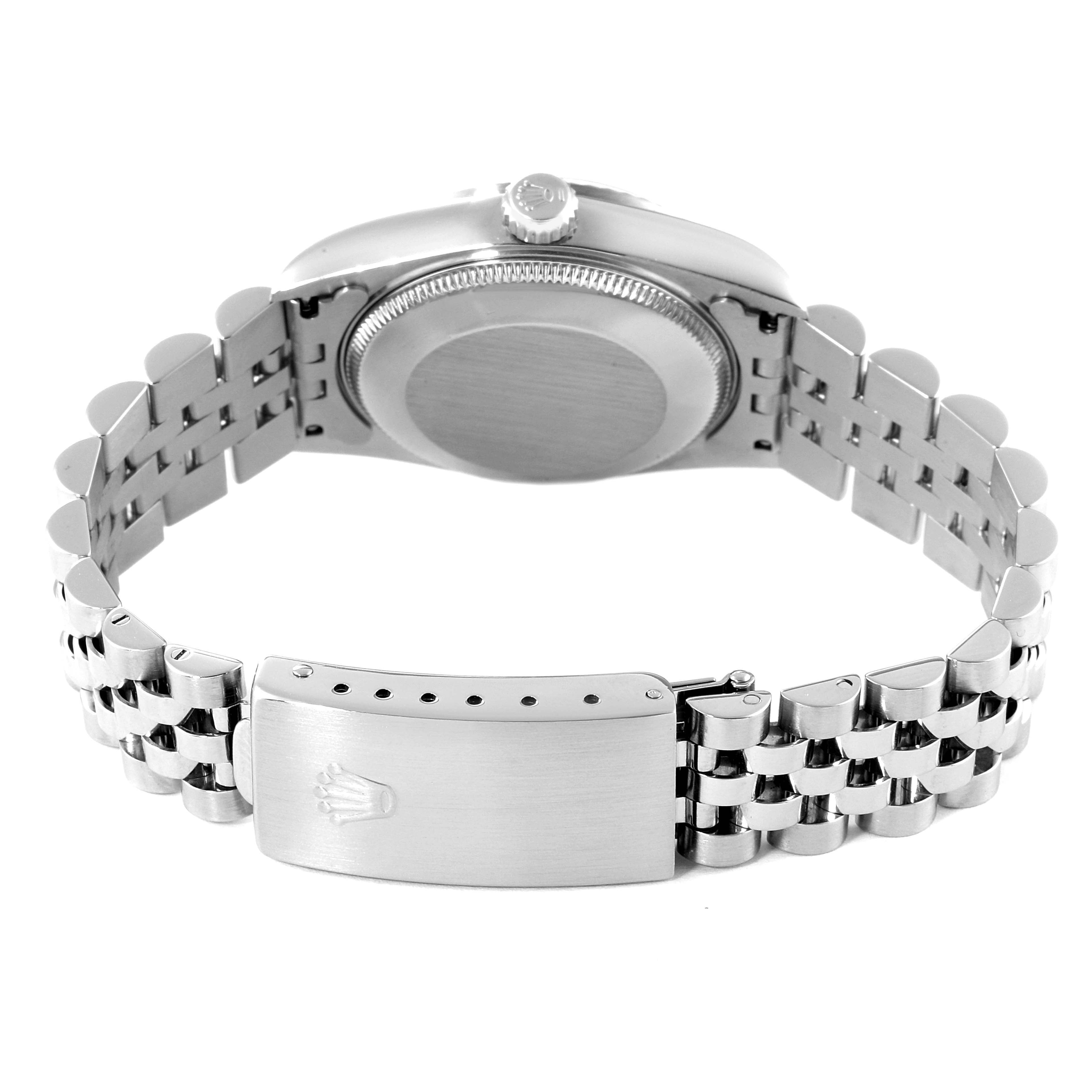 The image shows the back view of the Mid-Size Rolex watch with its case back, crown, and Jubilee bracelet displayed.