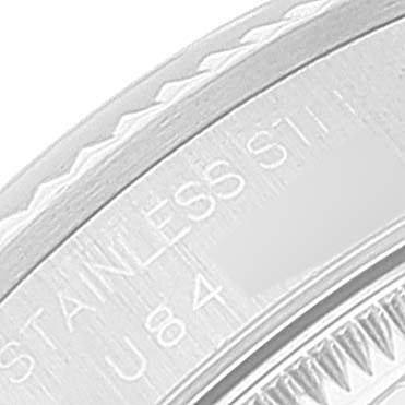 The image shows a close-up view of the edge and inscriptions on the stainless steel case back of a Rolex Mid-Size 68274 Women
s Stainless Steel Blue Dial 68274 Women
s Stainless Steel Blue Dial model watch.