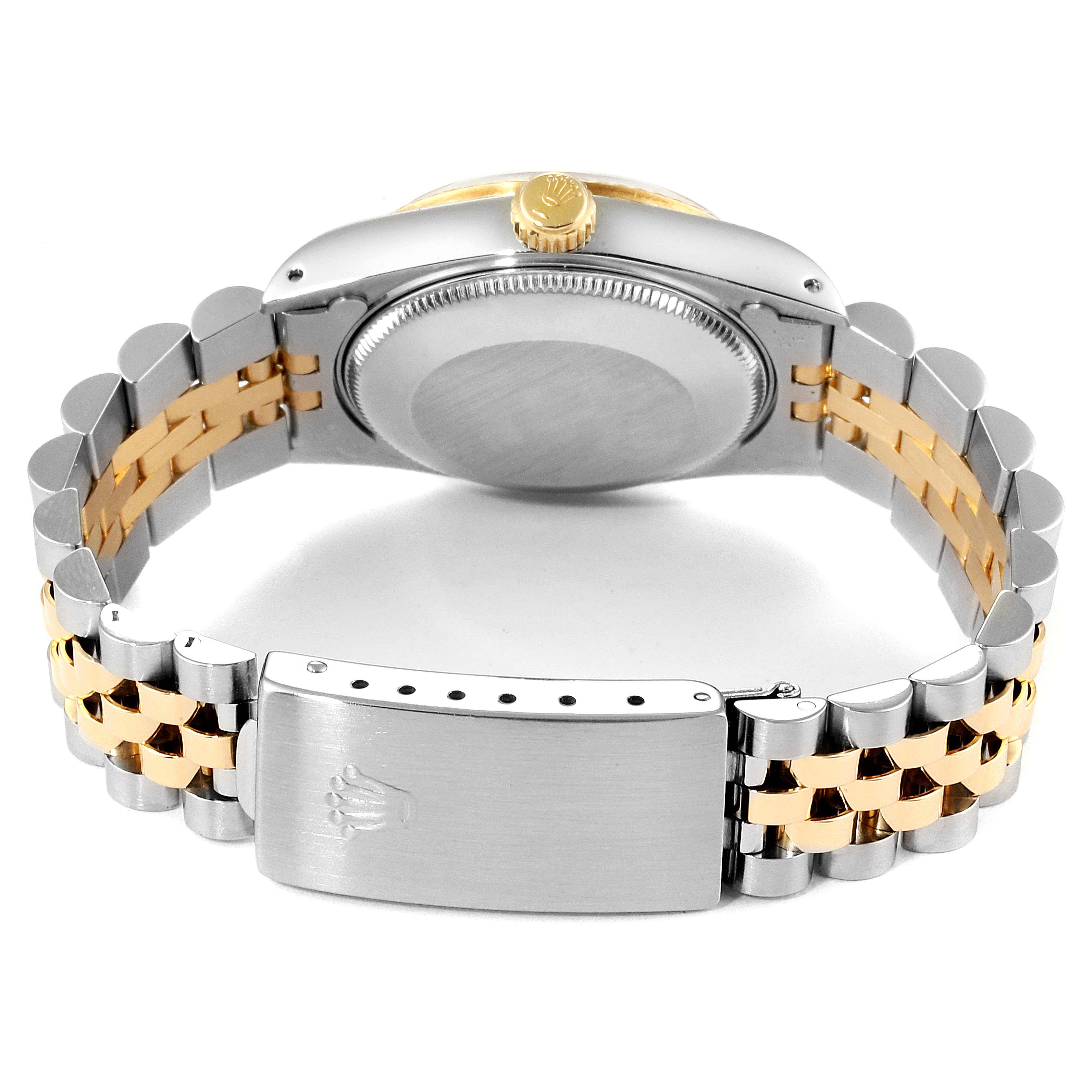 The image shows the back view of a Rolex Mid-Size 68273 Women
s Steel and Gold (two tone) Champagne Dial 68273 Women
s Steel and Gold (two tone) Champagne Dial model watch, focusing on the case back, clasp, and bracelet.