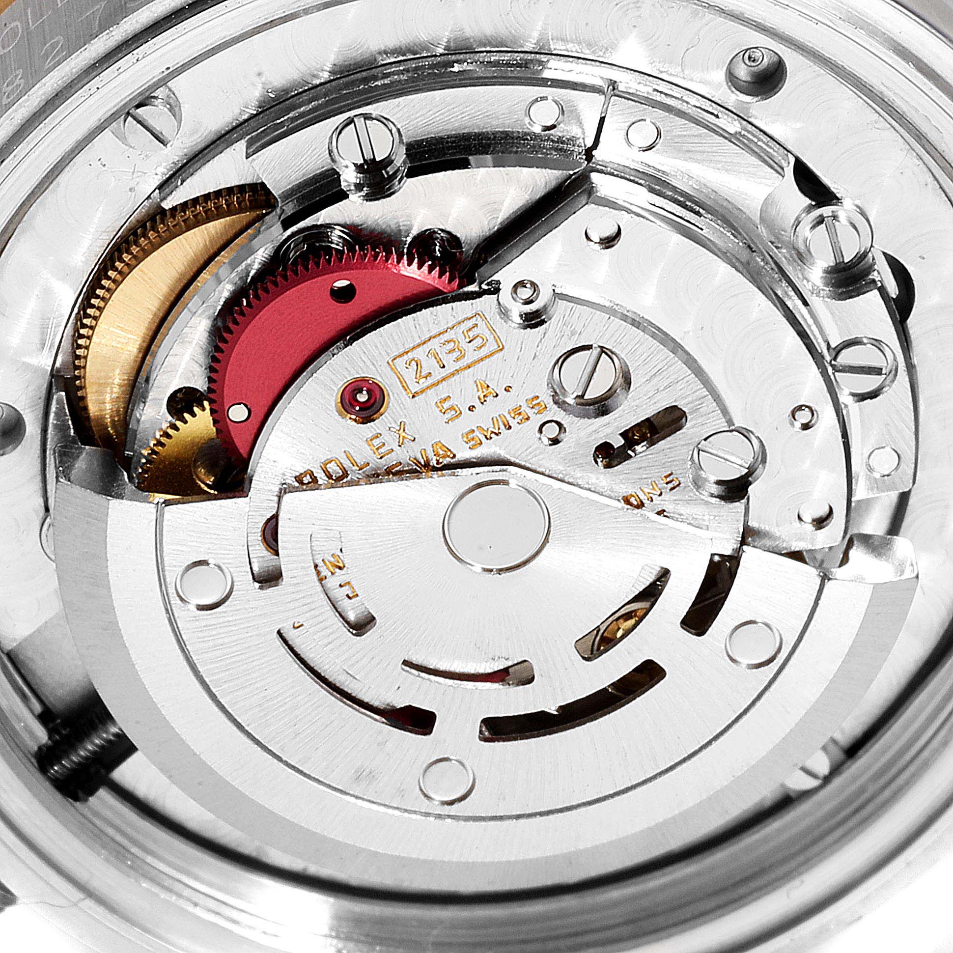 This image shows a detailed view of the movement mechanism of a Mid-Size Rolex watch.