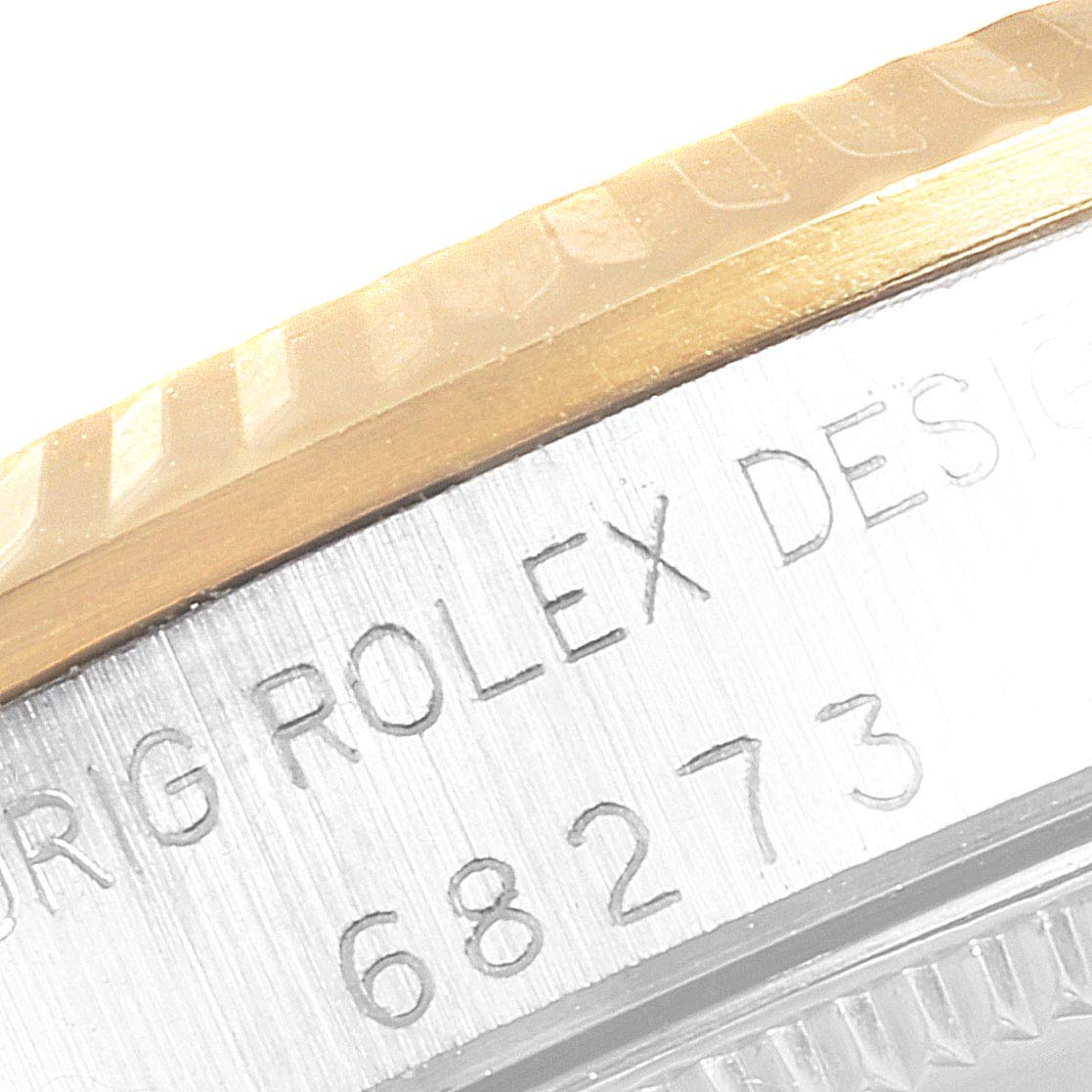 The image shows a close-up angle of the side case and bezel of a Mid-Size Rolex model 68273.