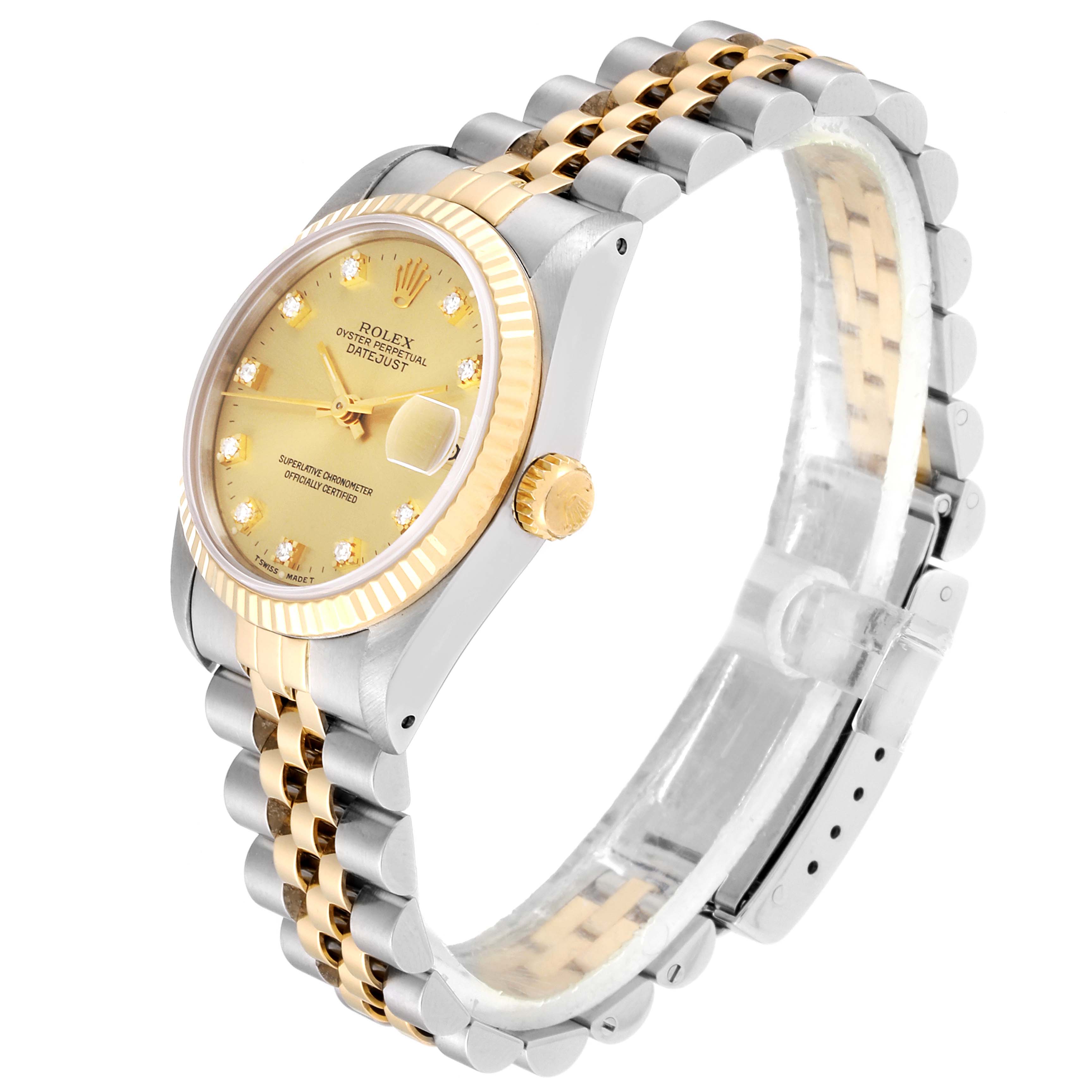 The Rolex Mid-Size 68273 Women
s Steel and Gold (two tone) Champagne Dial 68273 Women
s Steel and Gold (two tone) Champagne Dial watch is shown at a slightly tilted side angle, displaying the face, bezel, crown, and two-tone bracelet.