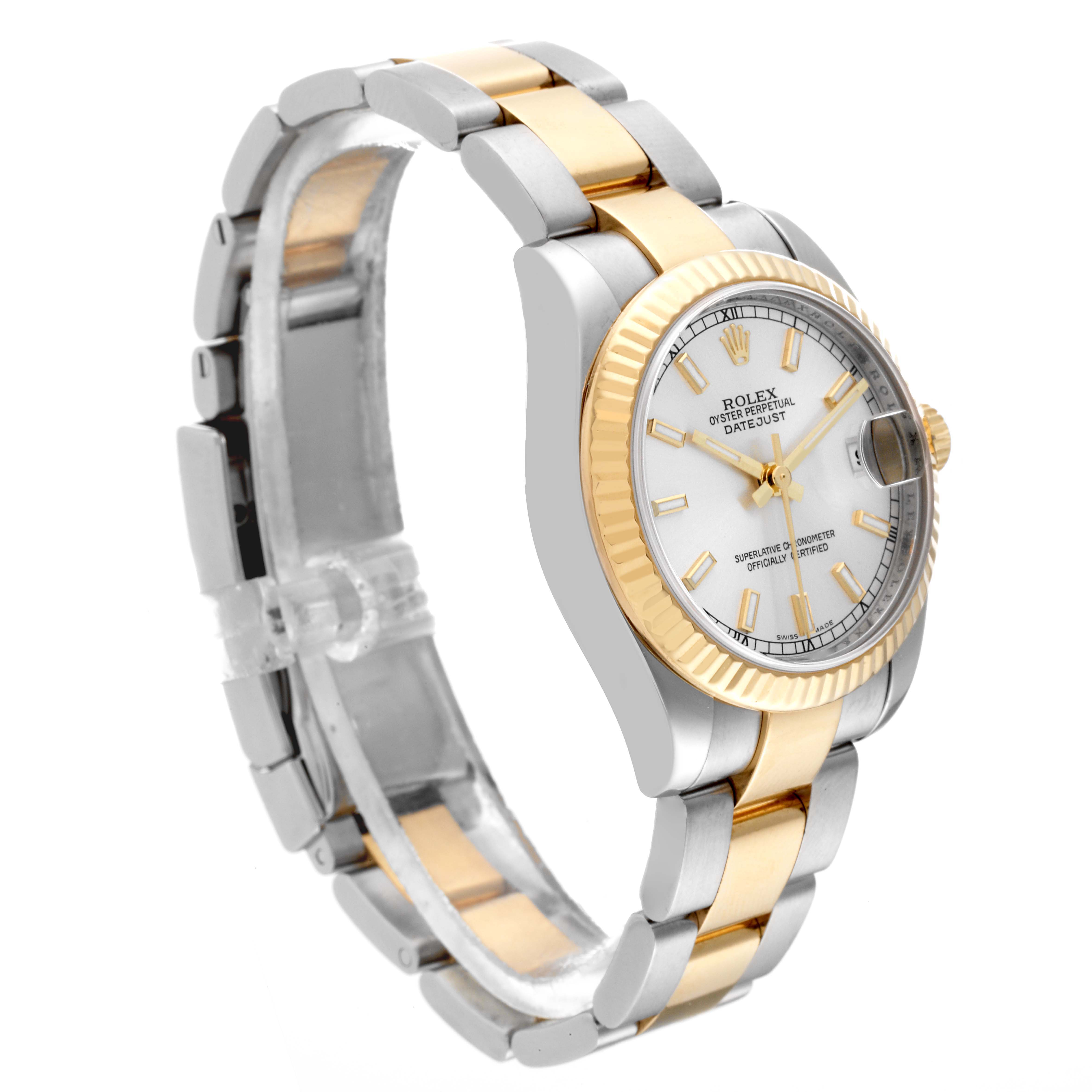 The Rolex Mid-Size 178273 Women's Steel and Gold (two tone) Silver Dial 178273 Women's Steel and Gold (two tone) Silver Dial Datejust watch is shown from an angled side view, displaying the face, bezel, and strap.