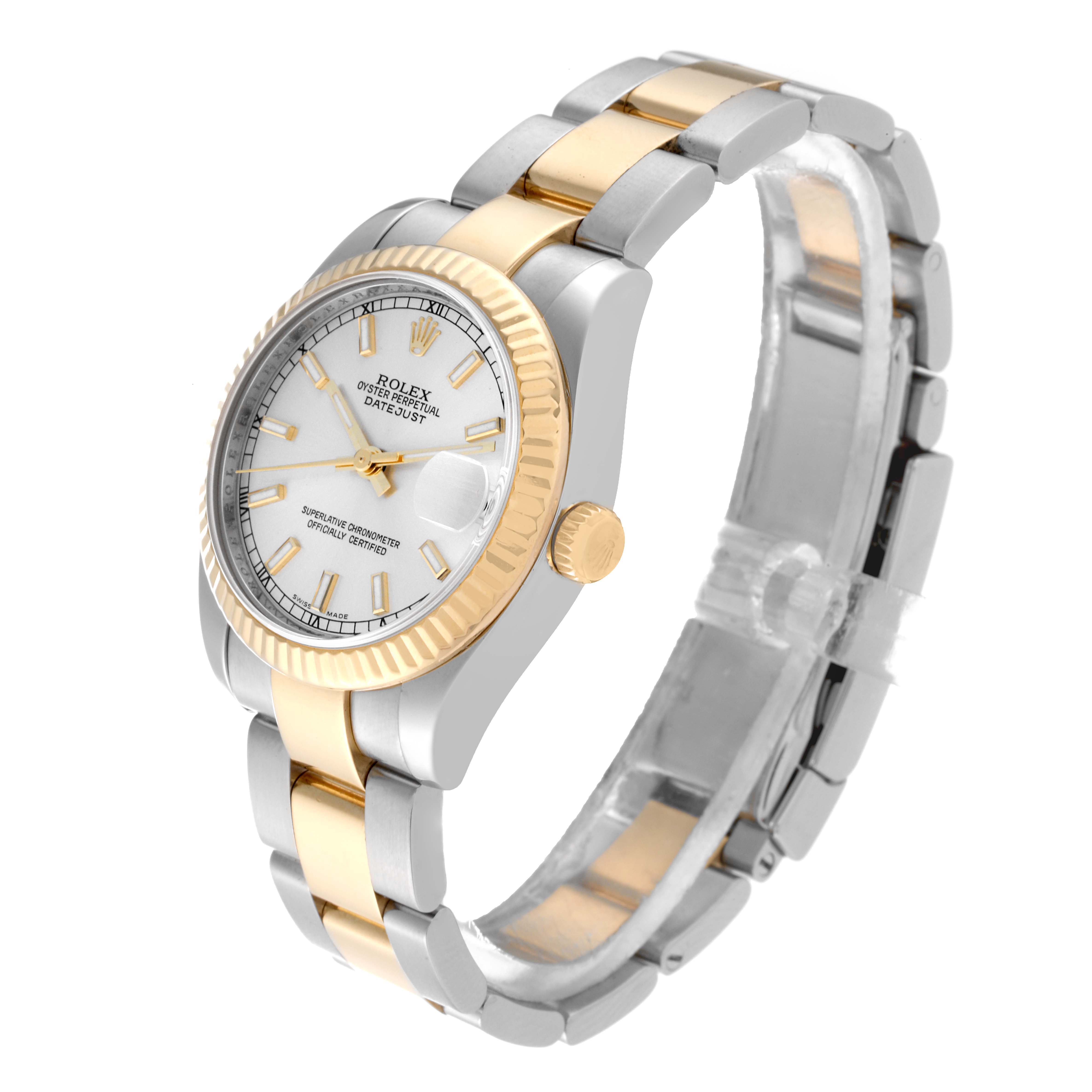 The image shows a side view of a Rolex Mid-Size 178273 Women's Steel and Gold (two tone) Silver Dial 178273 Women's Steel and Gold (two tone) Silver Dial model watch, highlighting its gold bezel, crown, and two-tone bracelet.