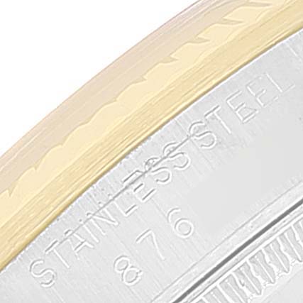 The image shows a close-up of the side of a Rolex Mid-Size 68273 Women
s Steel and Gold (two tone) Silver Dial 68273 Women
s Steel and Gold (two tone) Silver Dial watch, highlighting the stainless steel material and part of the watch’s edge.