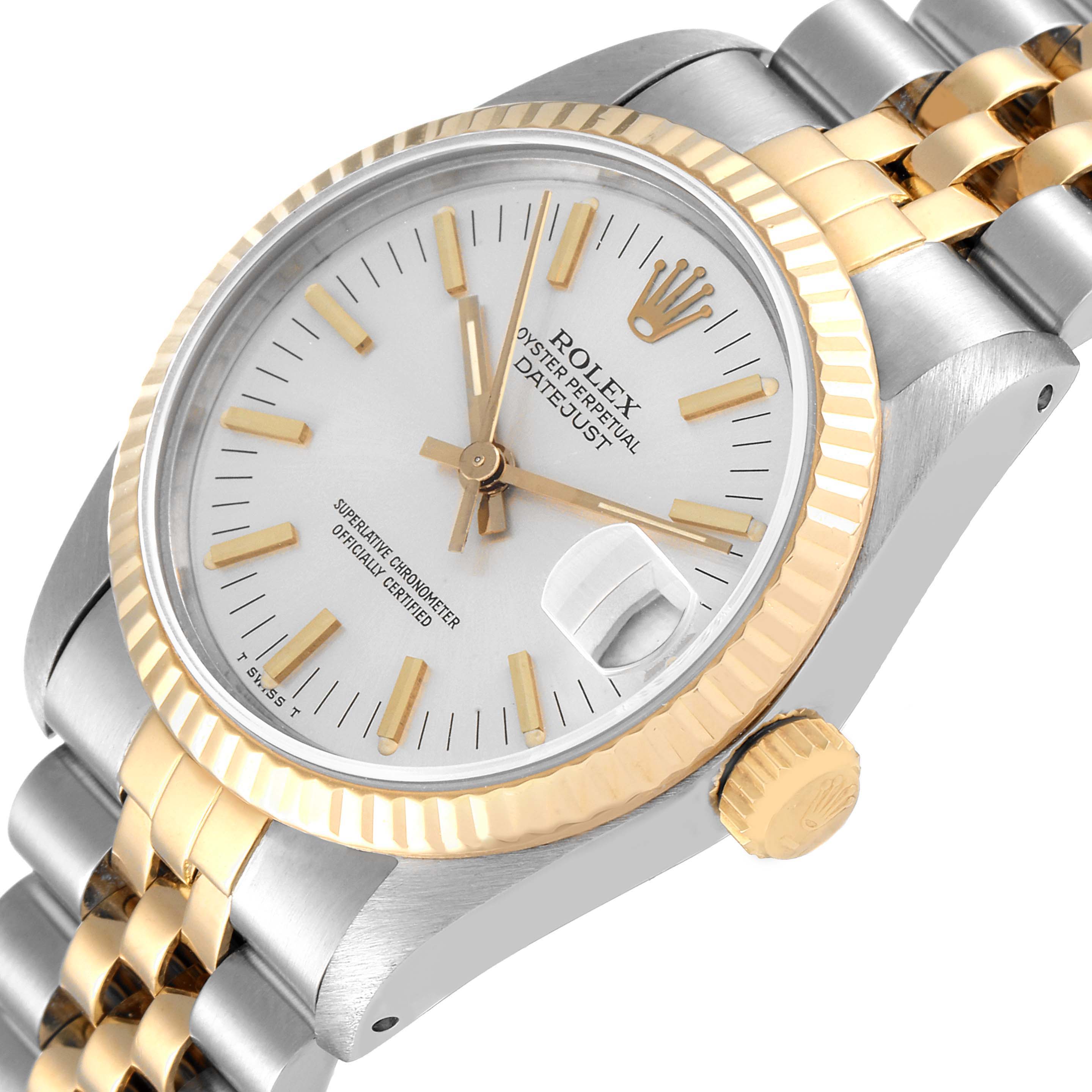 This image shows a Rolex Datejust Mid-Size watch at an angled top-down view, highlighting the dial, bezel, crown, and bracelet.