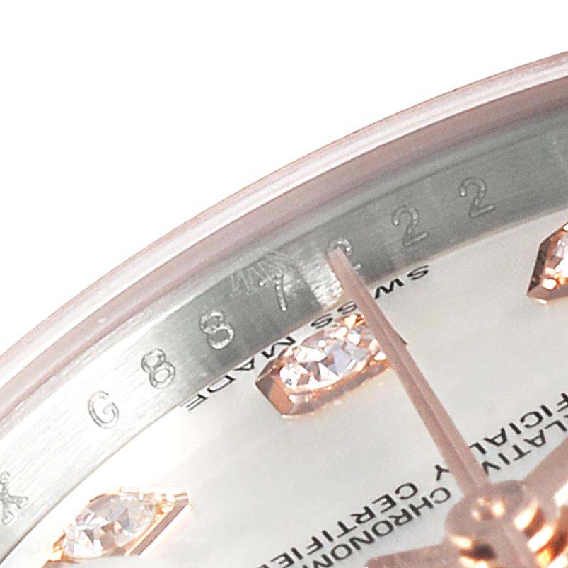 This image shows a close-up of the dial and diamonds on the Datejust Rolex, angled from the 10 to 12 o'clock position.