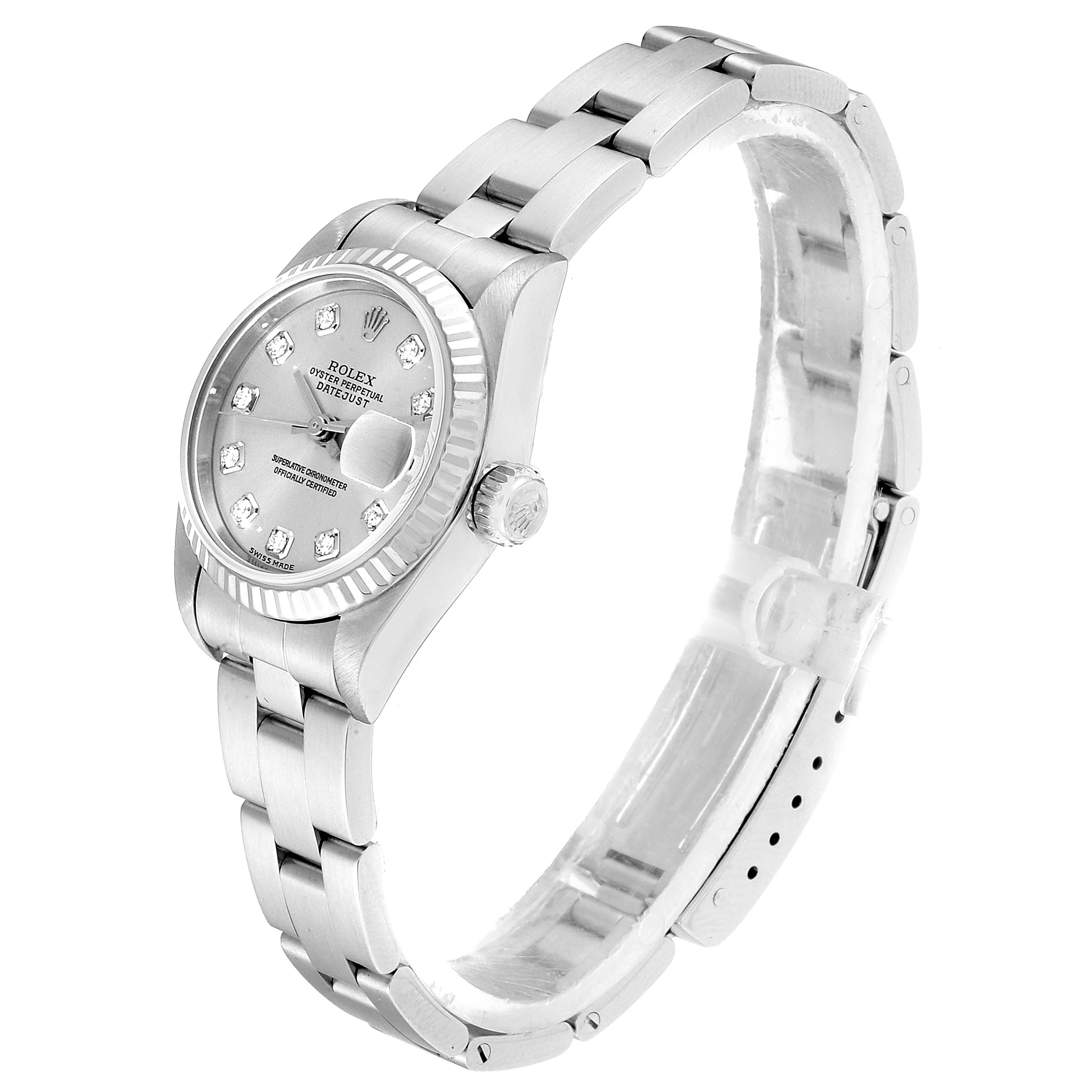 The image shows a side view of a Rolex Datejust 79174 Women
s Stainless Steel Silver Dial 79174 Women
s Stainless Steel Silver Dial watch, highlighting its face, fluted bezel, and linked bracelet.