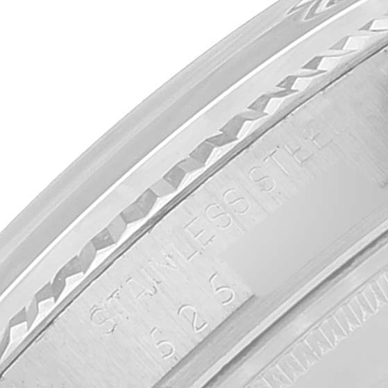 This image shows a close-up of the side of the Vintage Collection Rolex watch, specifically highlighting the stainless steel engravings.