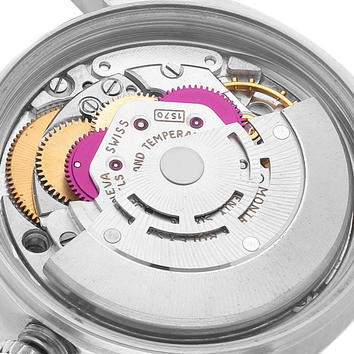 This image captures the intricate inner mechanism of the Rolex Vintage Collection 1601 Men's Stainless Steel Grey Dial 1601 Men's Stainless Steel Grey Dial watch, showcasing gears and other internal components from a close-up angle.