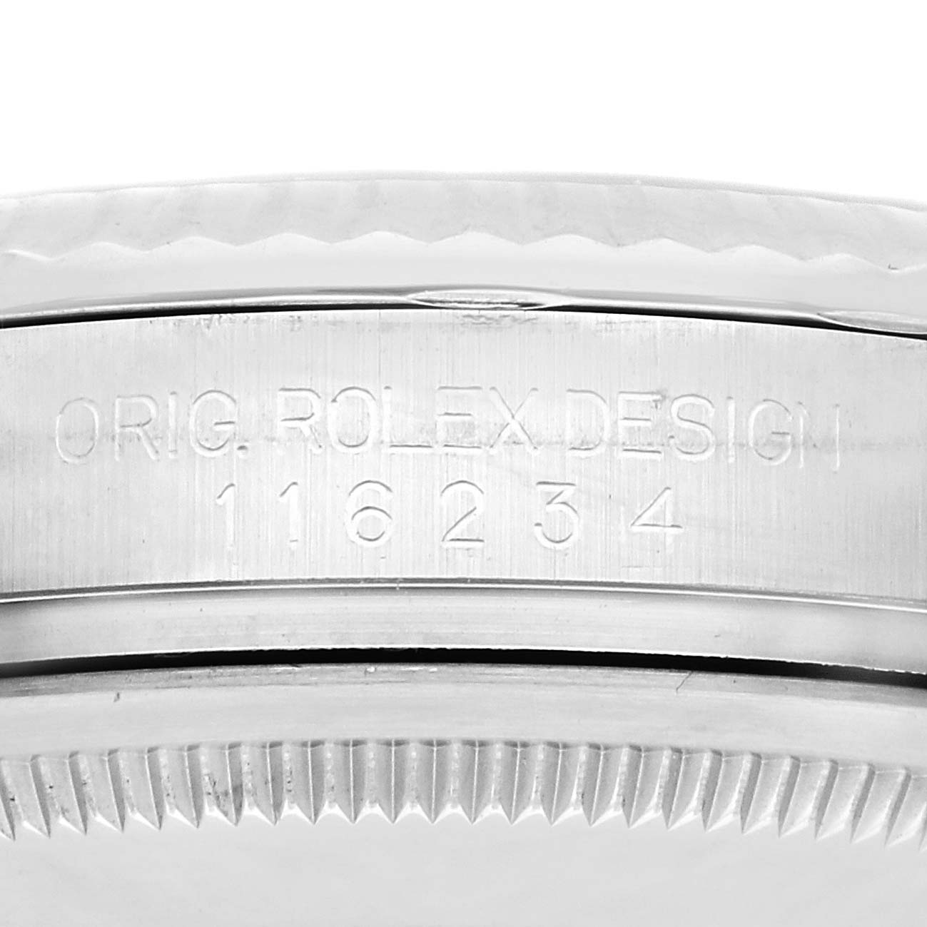 The image shows the side engraving on the case of a Rolex Datejust 116234 Men
s Stainless Steel Silver Dial 116234 Men
s Stainless Steel Silver Dial watch, indicating model details.