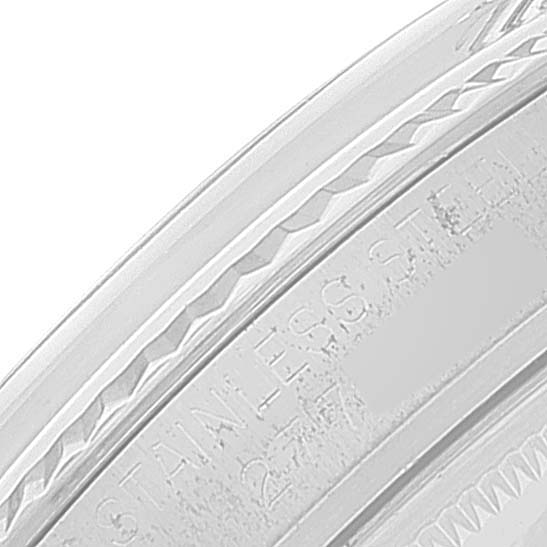 This close-up image shows the stainless steel watch bezel and engraved text part of the Vintage Collection model by Rolex.